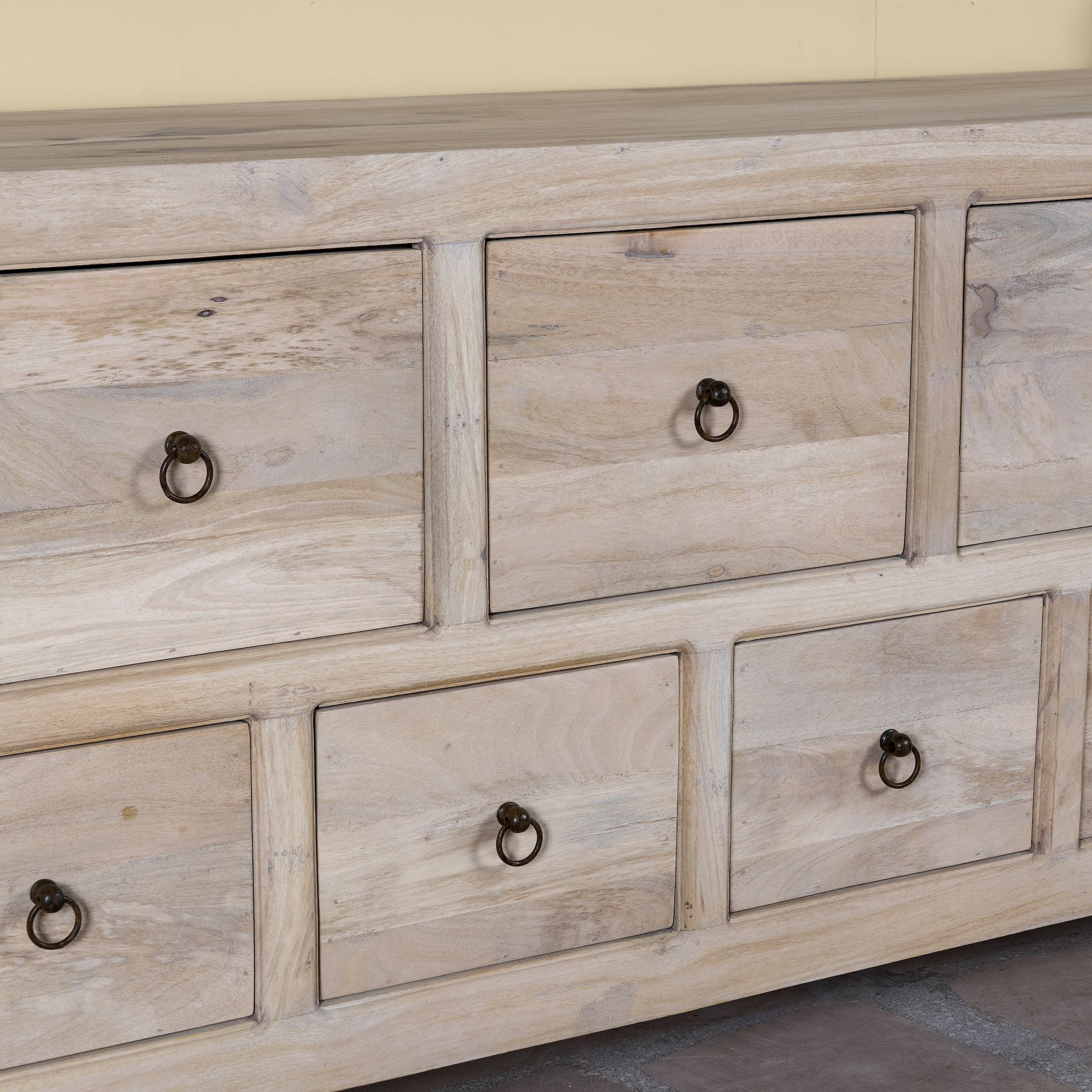 Close up image of a reclaimed sandblasted wooden chest of drawers with 11 drawers, part of our Ibiza style furniture collection.