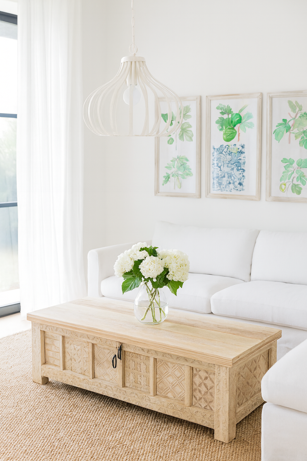 Lifestyle imagination of a Ibiza style carved mango wood chest with sandblasted finish and iron lock; 150 × 40 × 45 cm.