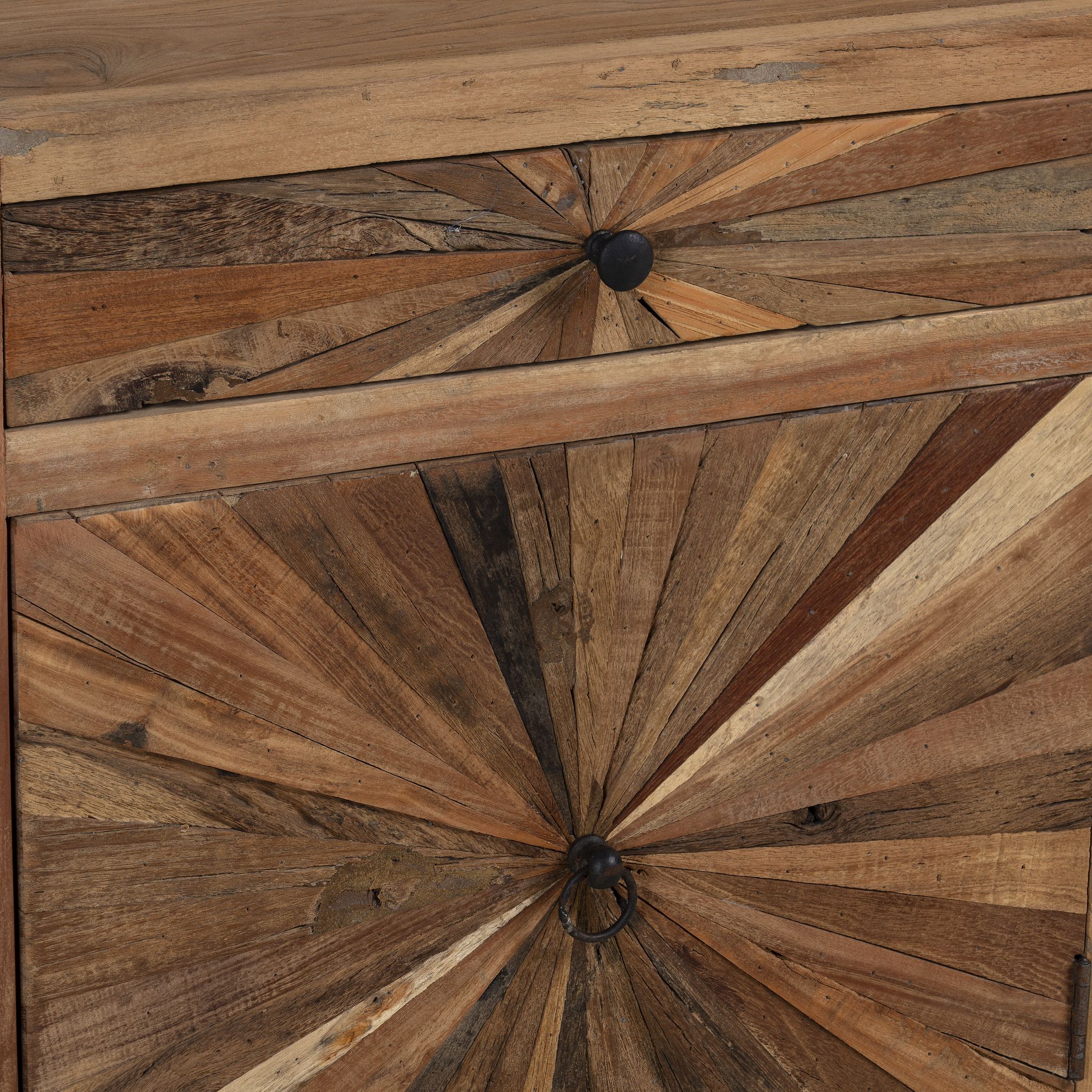 Close up image of a driftwood cabinet with sunburst front pattern and iron legs, one drawer and cabinet; looks great as sink base cabinet or accent furniture, 63 × 40 × 73 cm.
