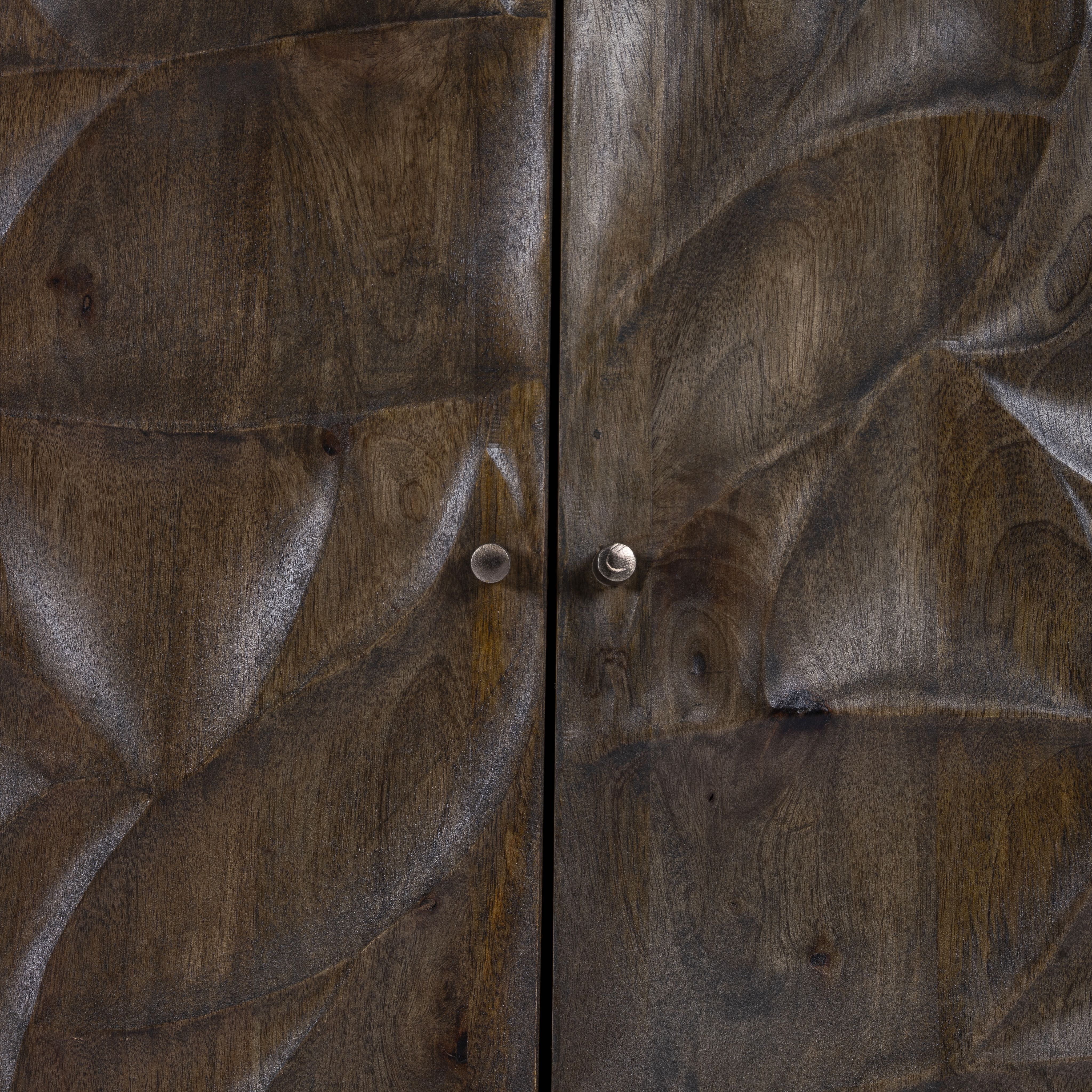 Close up image of a hand-carved mango wood sideboard with brass-plated iron stand—an artisanal, minimalistic furniture piece combining natural warmth and modern elegance.
