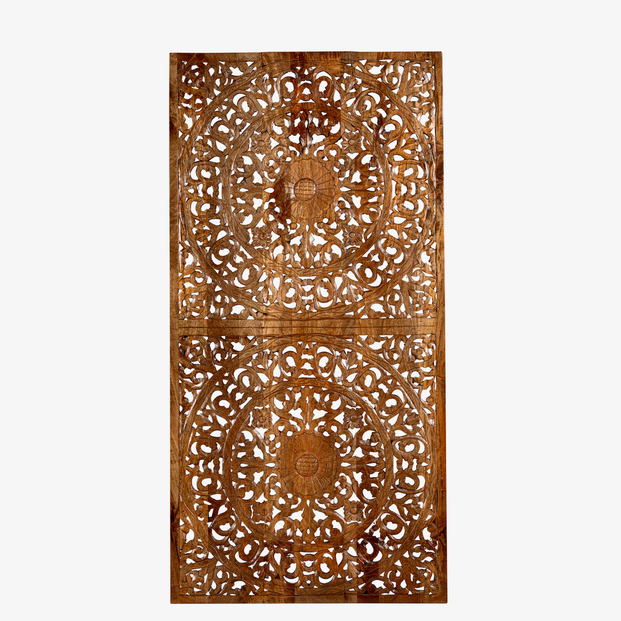 White background image of a hand-carved mango wood wall panel in natural finish with floral designs – Asamanja model by Om Home & Garden