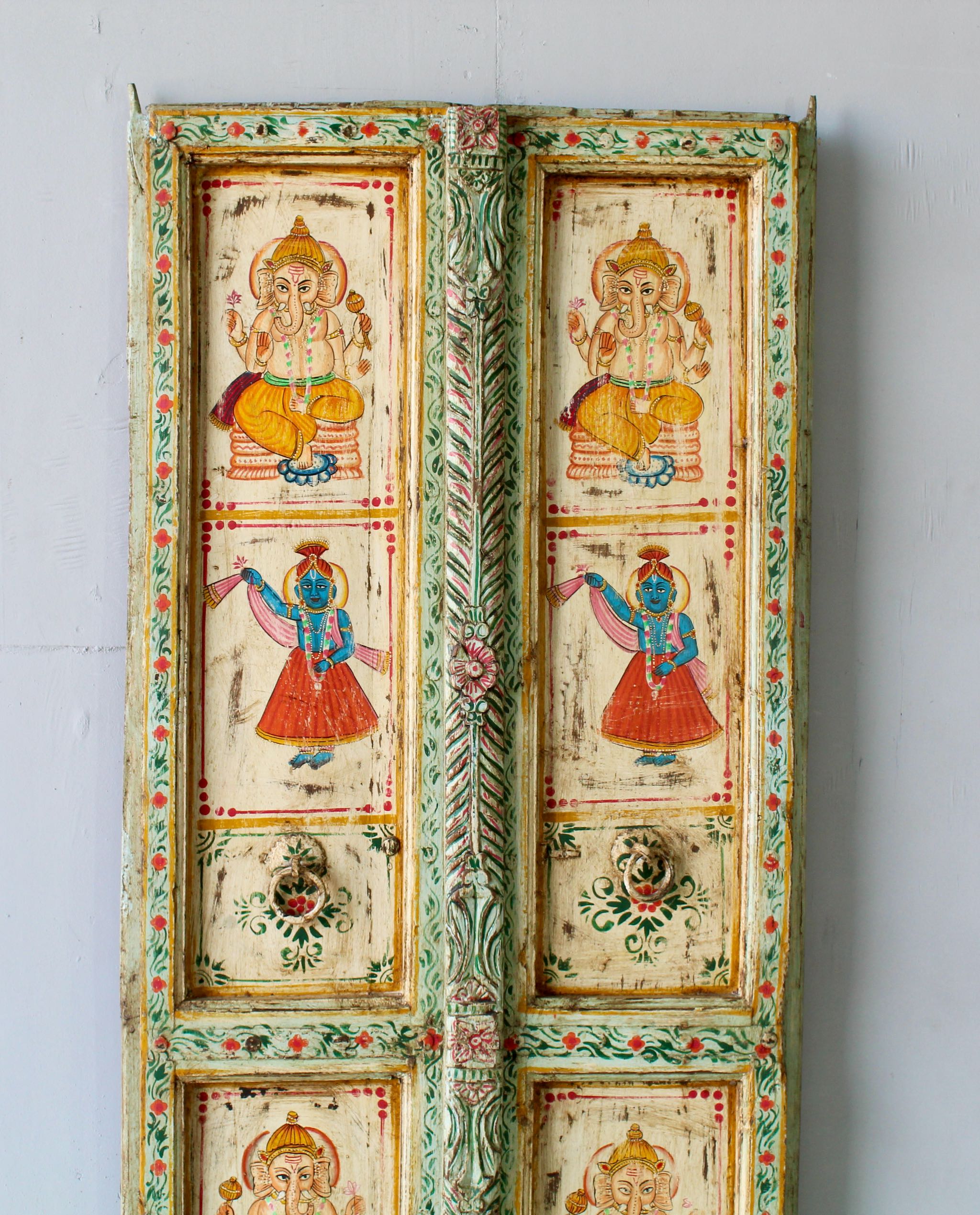 Hand-painted old Indian teak door panel with gods motifs in vintage style.