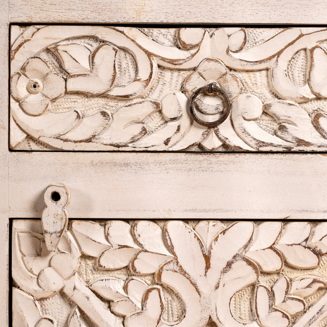 Close up image of a pair of vintage night stands in mango wood with hand-carved geometric details and distressed finish; ideal for vintage home decor, 76 × 56 × 35 cm.