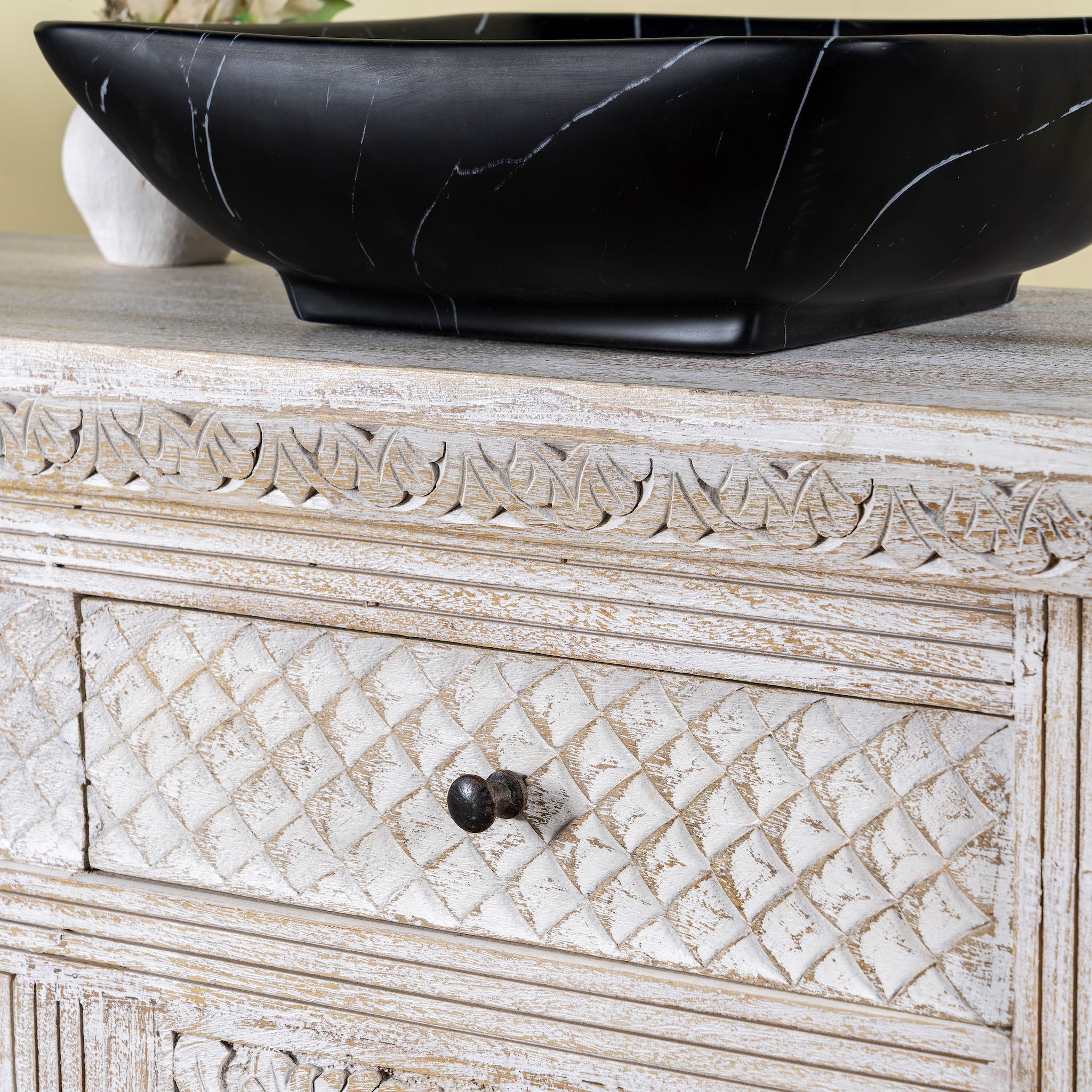 Close up image of a handcrafted wooden carved sideboard with oriental arches and whitewashed finish; perfect as an entryway table vintage feature, 160 × 80 × 40 cm.