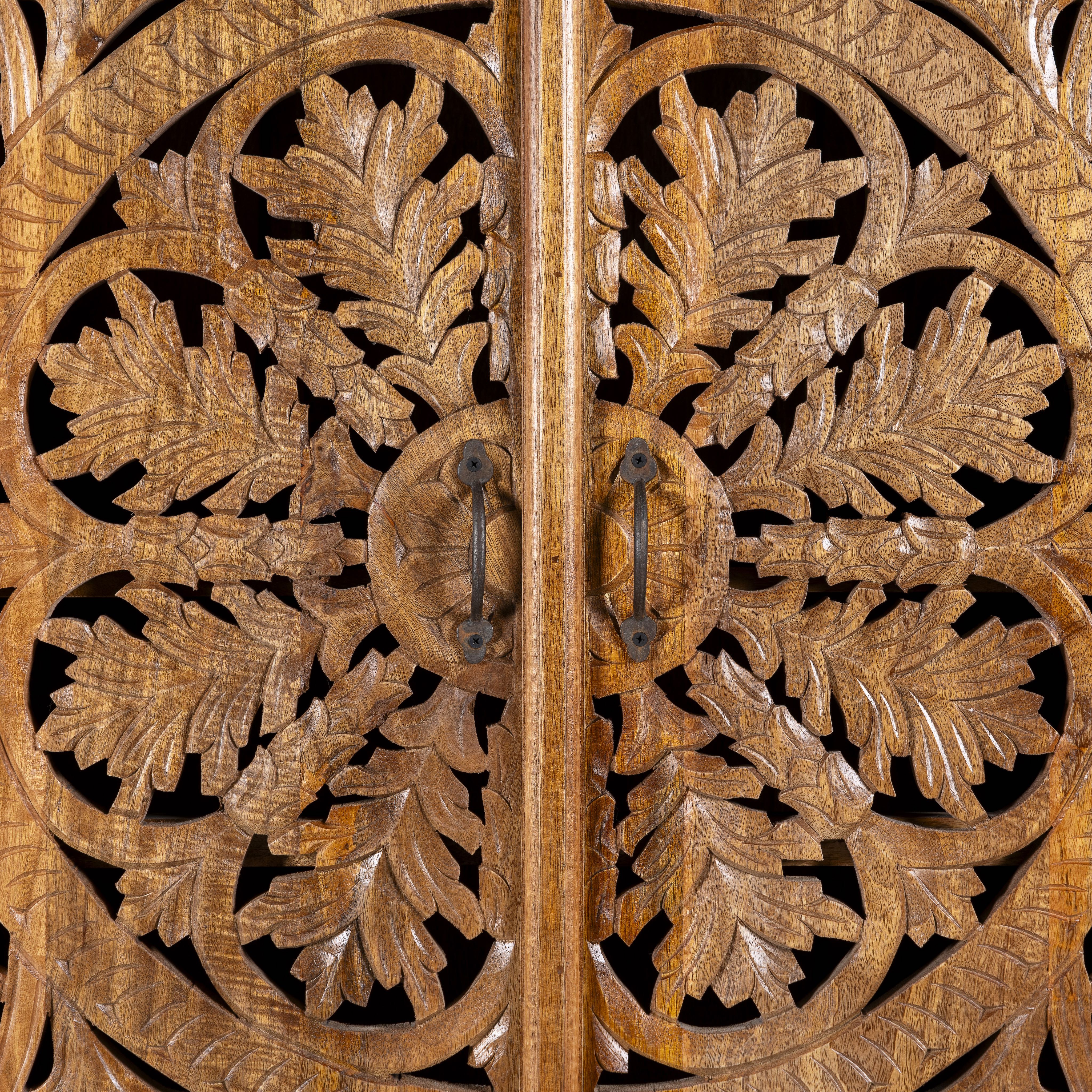 Close up image of a unique wooden wardrobe made from solid mango wood with hand-carved floral design and rounded shape, 100 × 40 × 190 cm.