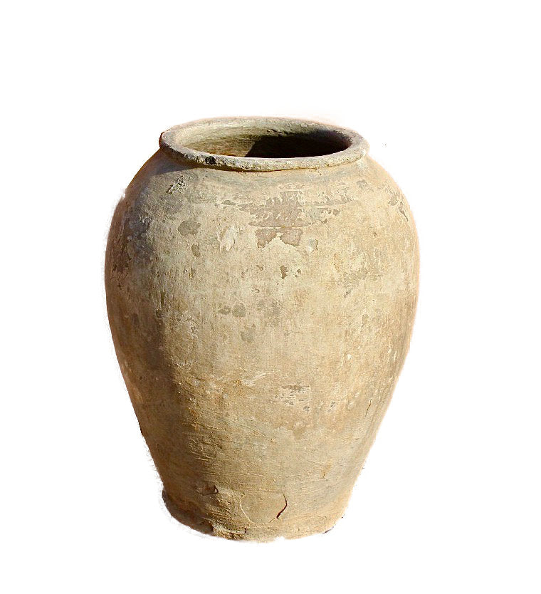 Close up image of an antique Indian clay vase with weathered surface – a Bali style clay vase ideal for Indian home decoration and rustic bohemian interiors.