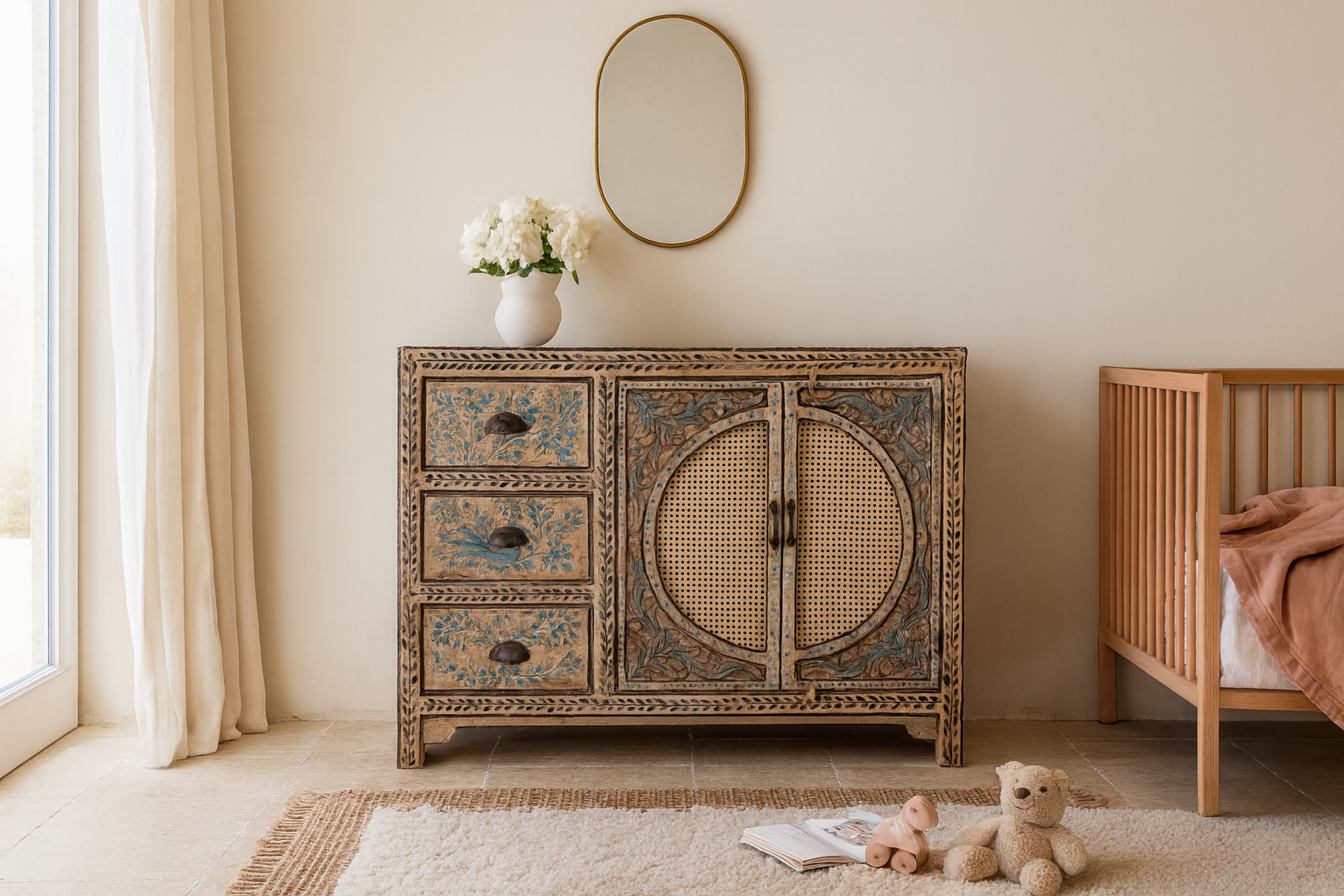 Life style image of a hand painted sideboard in blue and beige with rattan door inserts; unique furniture for boho style interiors, 120 × 40 × 92 cm.