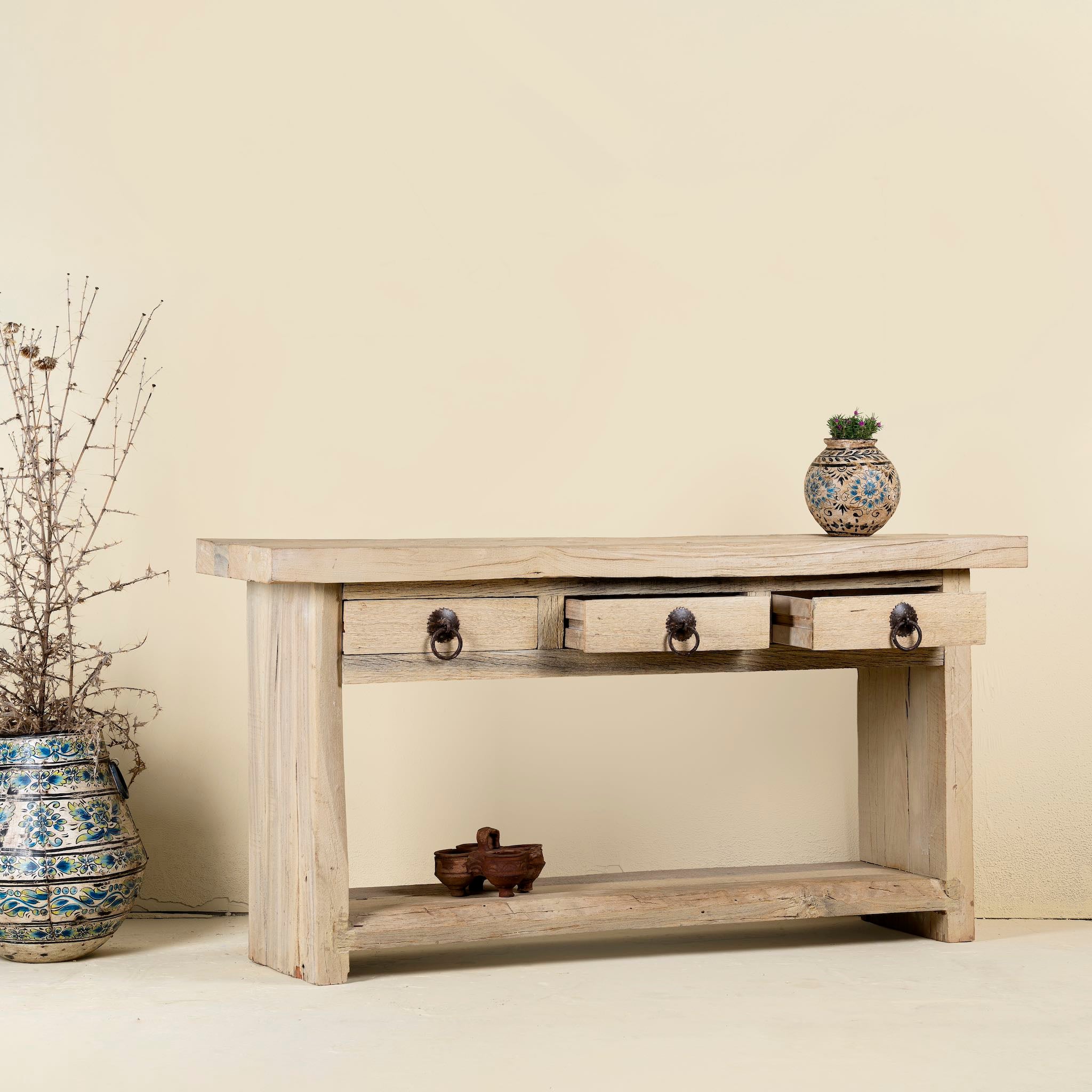 Open drawer image of a teak wood console table with sandblasted finish, three drawers and lower shelf; sustainable furniture for entryways, living rooms, or bathrooms, 160 × 30 × 80 cm.