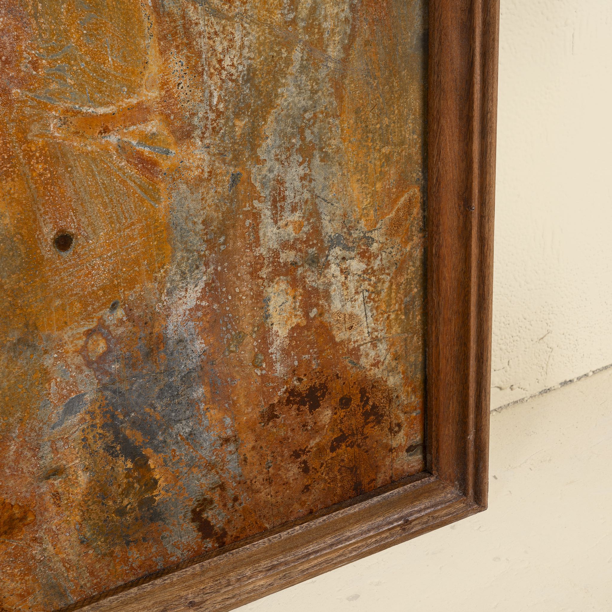 Close up image of a rusted iron and teak wall panel, artisanal furniture piece, part of our Indian home decor collection.