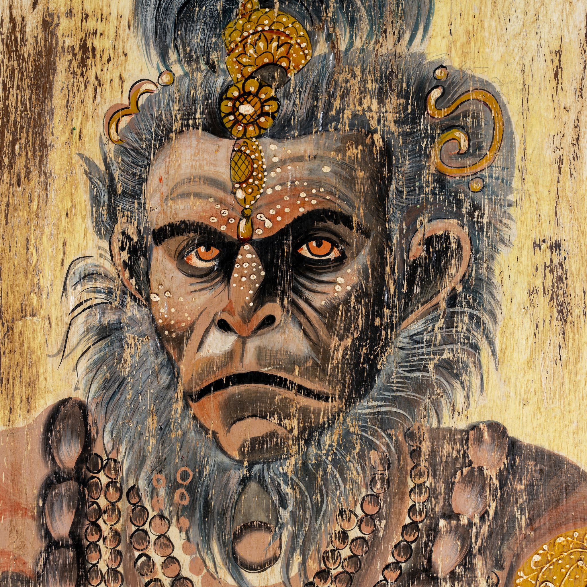 Close up image of a hand-painted vintage door panel measuring 52x3x152 cm, featuring detailed depictions of Hindu deities—Hanuman at the top, a divine scene with attendants in the center, and a serene portrayal of Lord Shiva with Parvati at the bottom—rendered on distressed wood for a timeworn, sacred aesthetic.