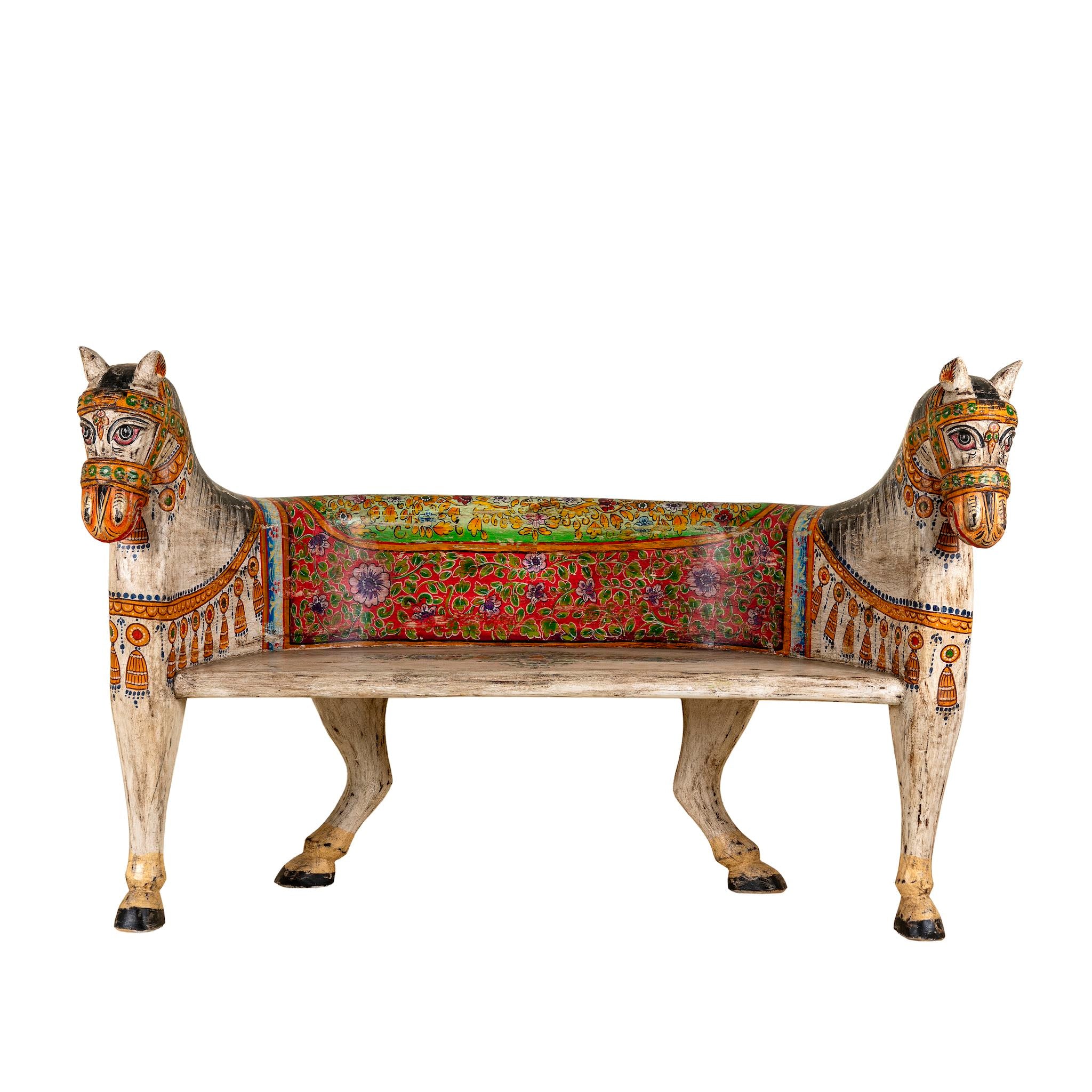 White background image of a hand-painted reclaimed wood chair-style horse bench with double carvings; unique furniture for a bohemian interior, 160 × 70 × 90 cm.