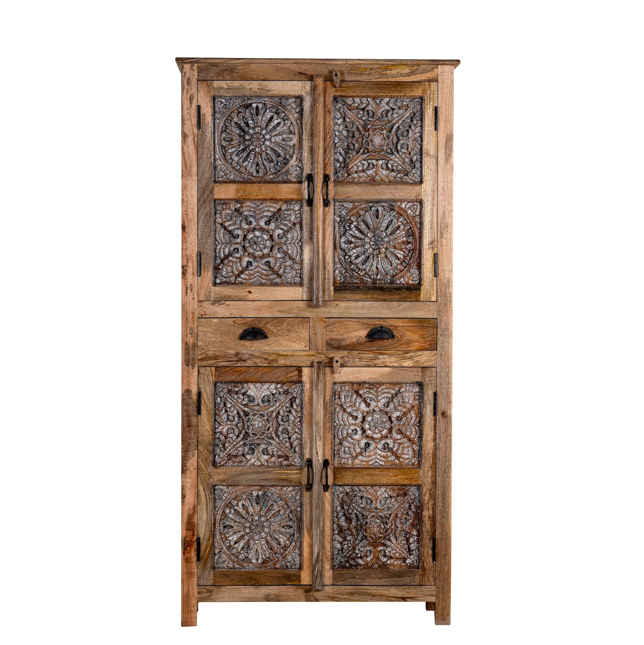 White background picture of a hand-carved mango wood cabinet with floral motifs and silver finish – bedroom furniture with rustic charm and artisanal detail.