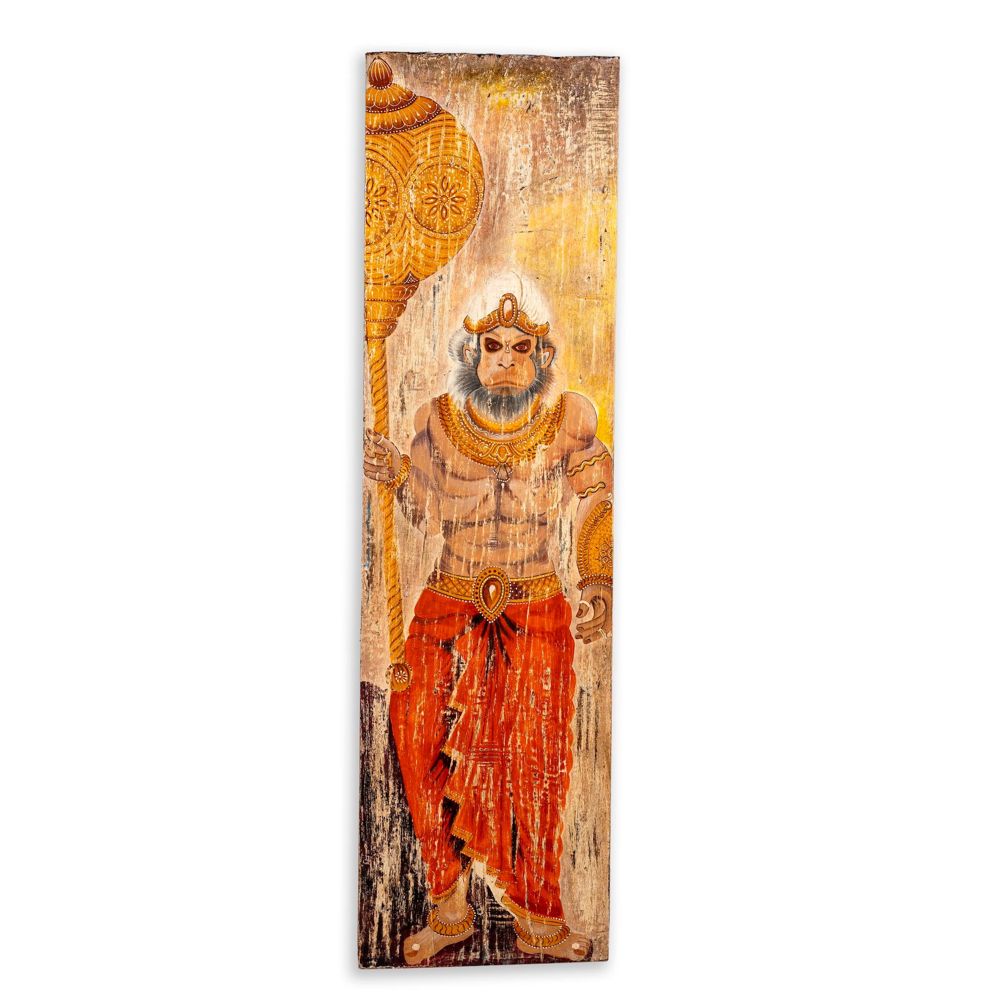 White background image of a hand-painted vintage door panel measuring 54x3x195 cm, depicting the powerful figure of Lord Hanuman holding a golden mace, adorned in traditional attire with intricate jewellery, set against a distressed wooden background for an aged, sacred appearance.
