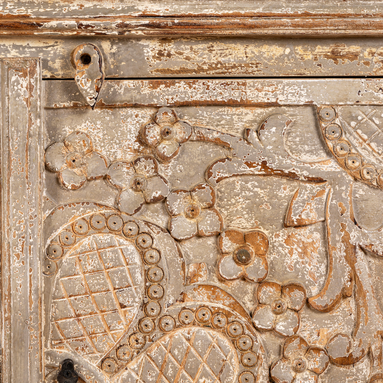 Close up image of a square carved wood sideboard with whitewashed floral detailing; ideal as living room furniture, 90 × 90 × 40 cm.