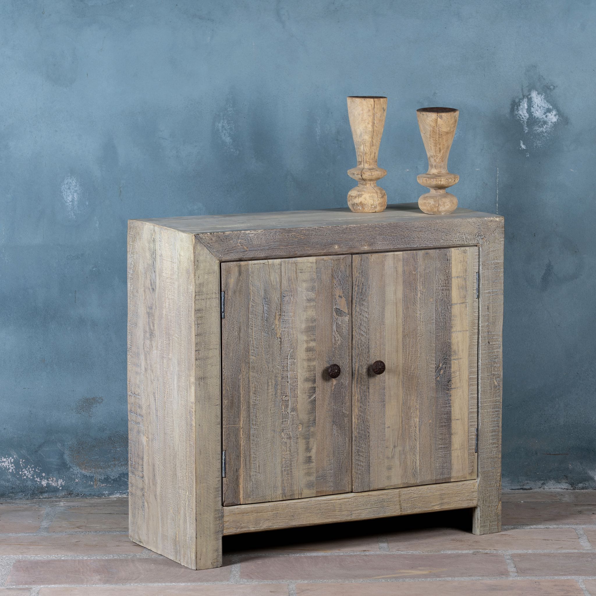 Side angle image of a Rustic cupboard made of reclaimed wood with two doors, sustainable bathroom furniture, 90 × 40 × 86 cm.