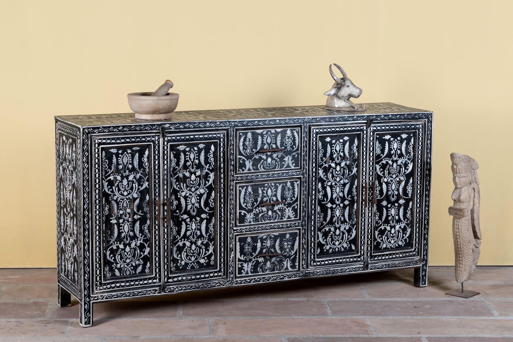 Side angle image of a hand-painted black and white sideboard made of reclaimed wood – Kaira model by Om Home & Garden