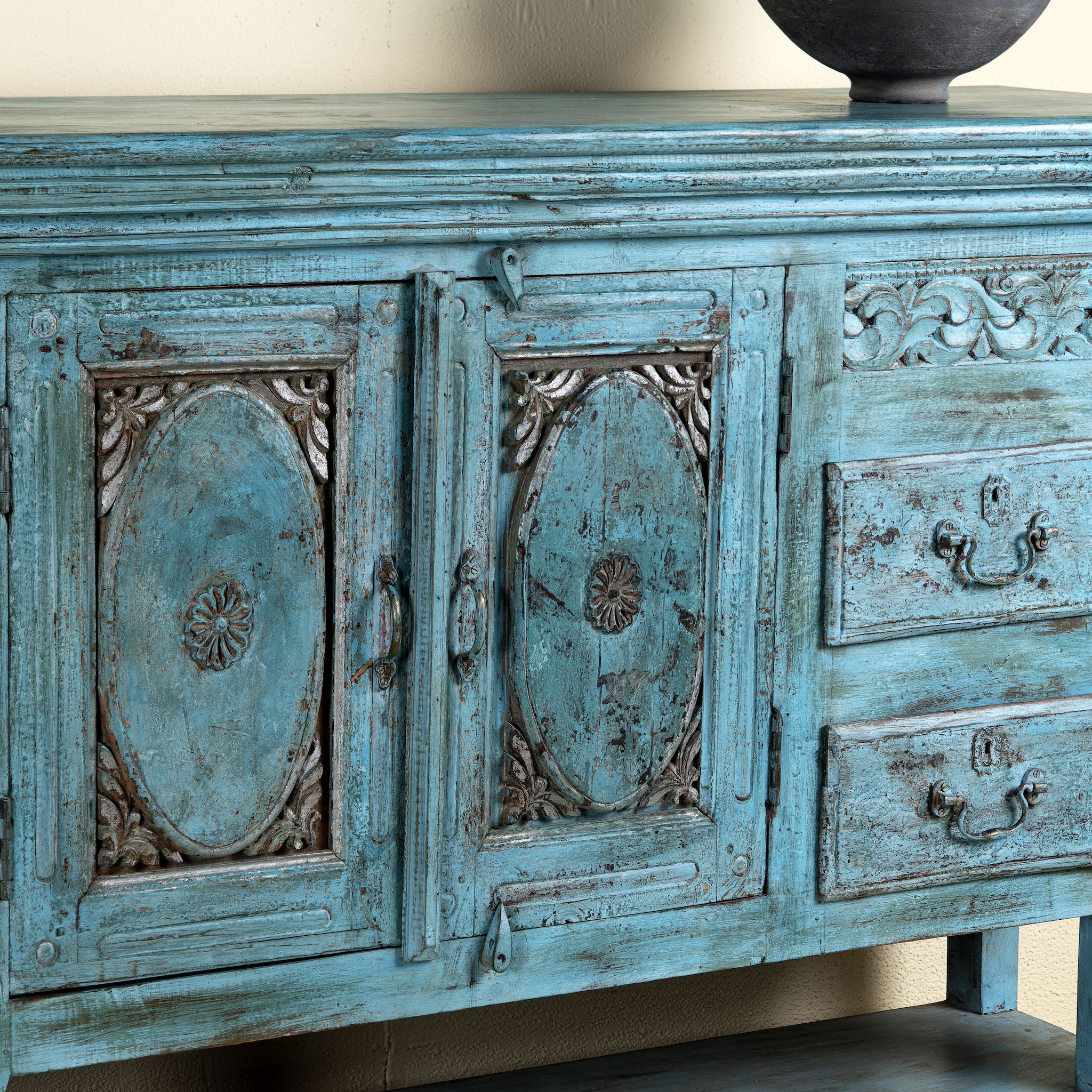 Close up image of Kalpana antique console table wood with turquoise patina, part of our teakwood tables collection.