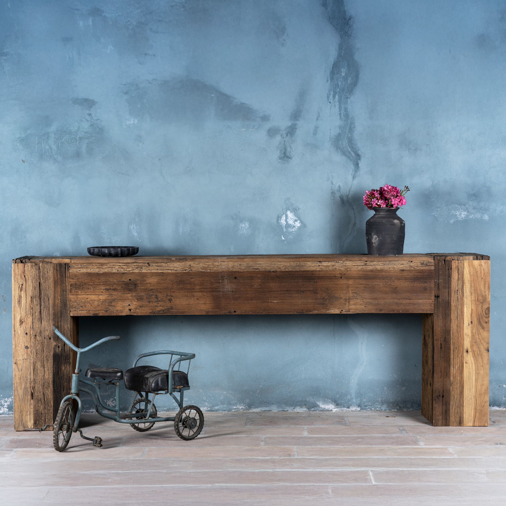 Rustic minimalistic console table made from reclaimed wood with preserved imperfections, block legs, 250 × 40 × 90 cm.