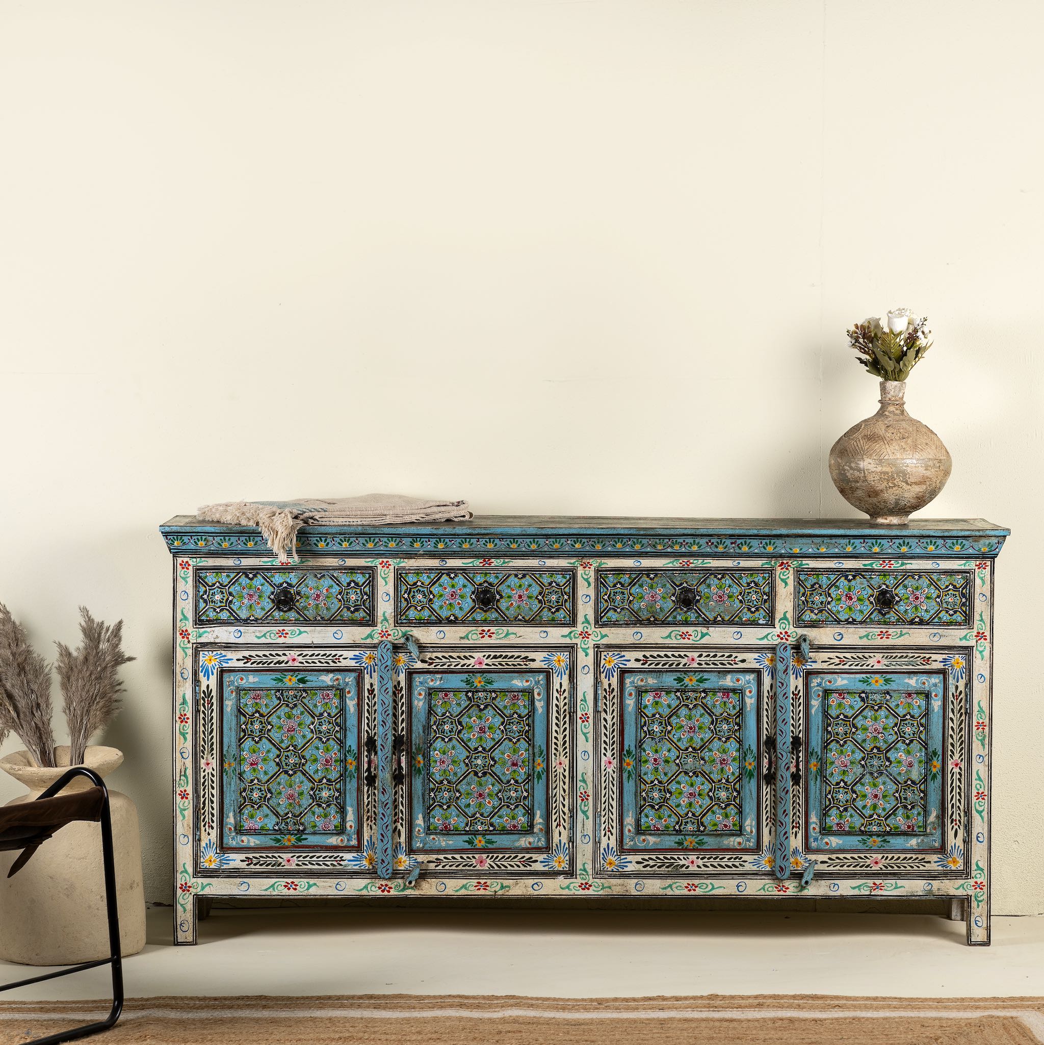 Hand painted furniture sideboard made from reclaimed teak wood with floral motifs, artisanal furniture in bohemian Mediterranean style, 180 × 40 × 90 cm.