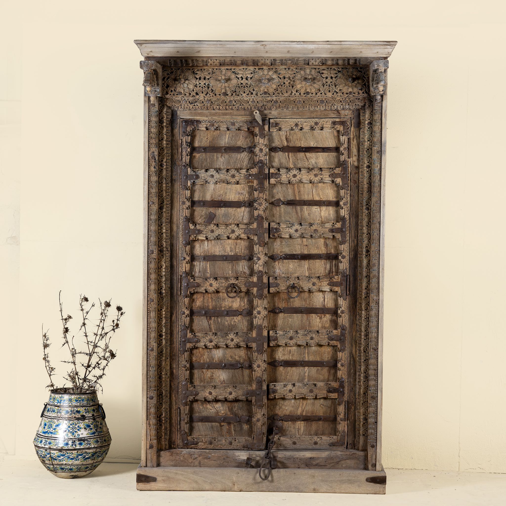 Mahika cabinet with antique carved teak door, part of our teak wood furniture collection, perfect for a bohemian interior.