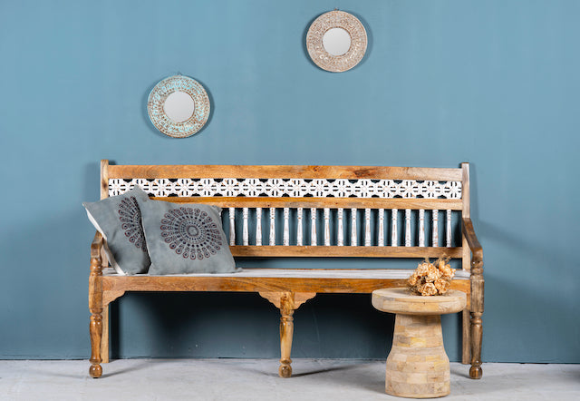 Hand carved mango wood bench with floral backrest and spindle accents; rustic mango wood seating, 176 × 56 × 95 cm.