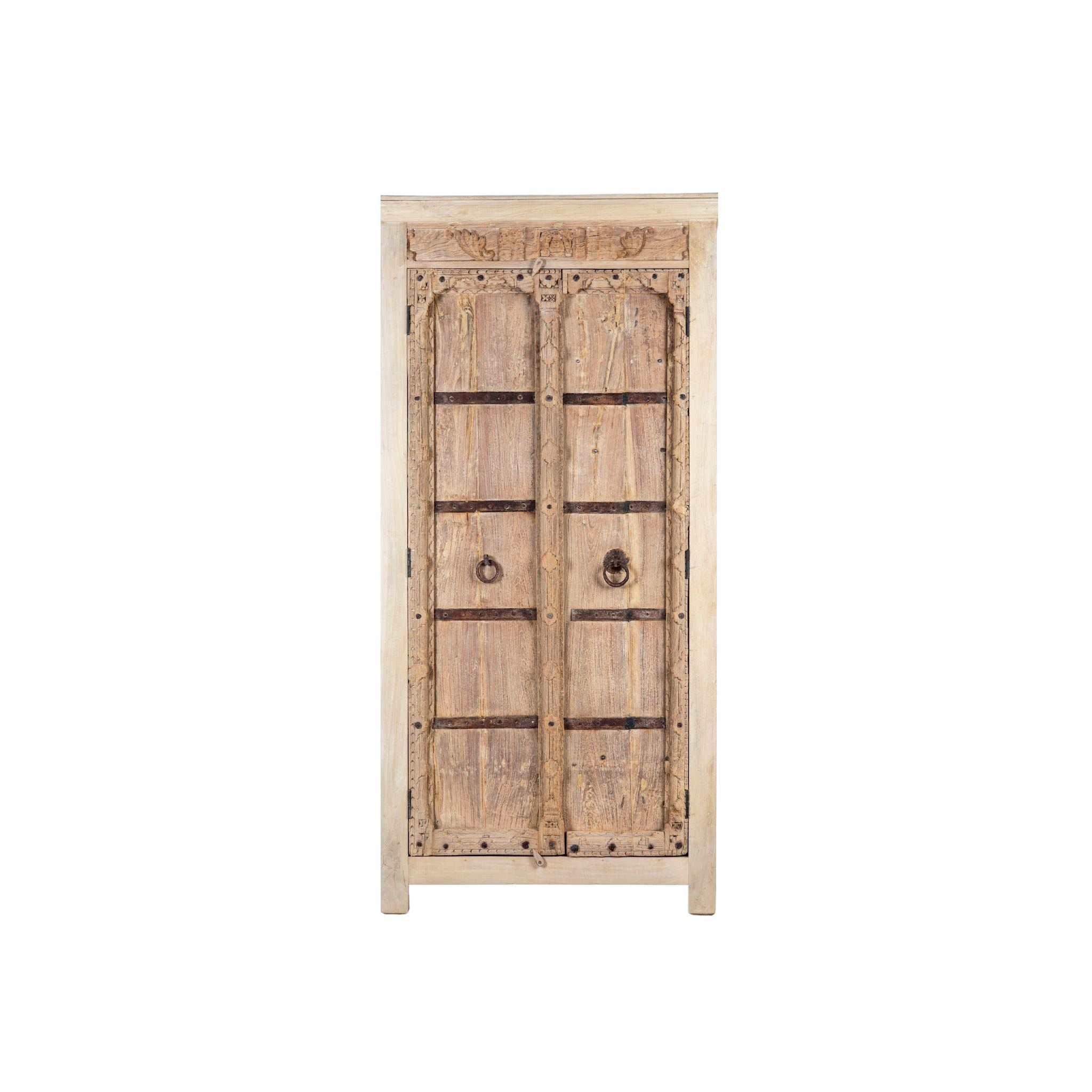 White background image of a rustic solid wood wardrobe featuring vintage reclaimed door panels with iron accents and ring pull handles.
