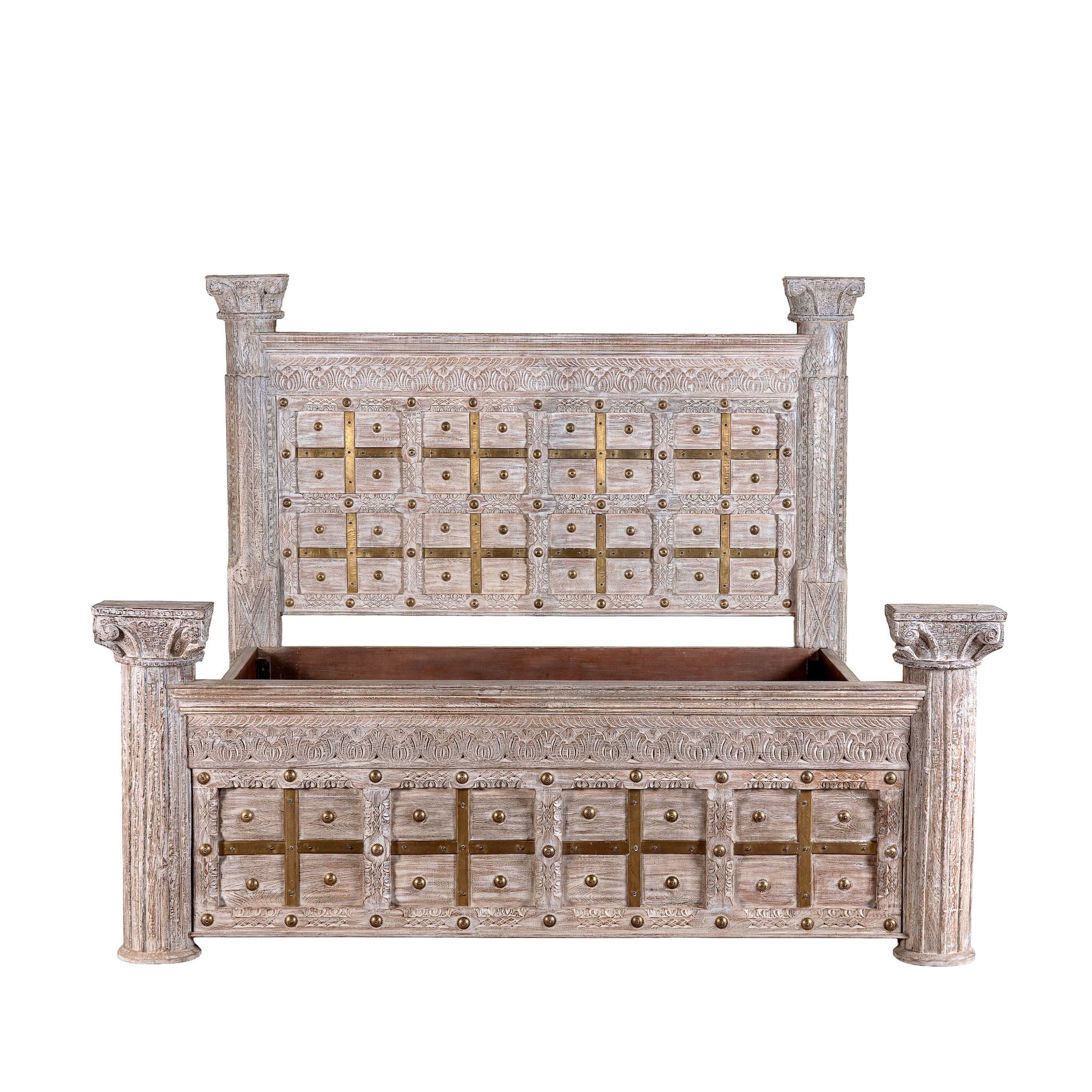 White background image of a handcrafted four poster bed made from reclaimed wood with carved detailing – Mirai model by Om Home & Garden