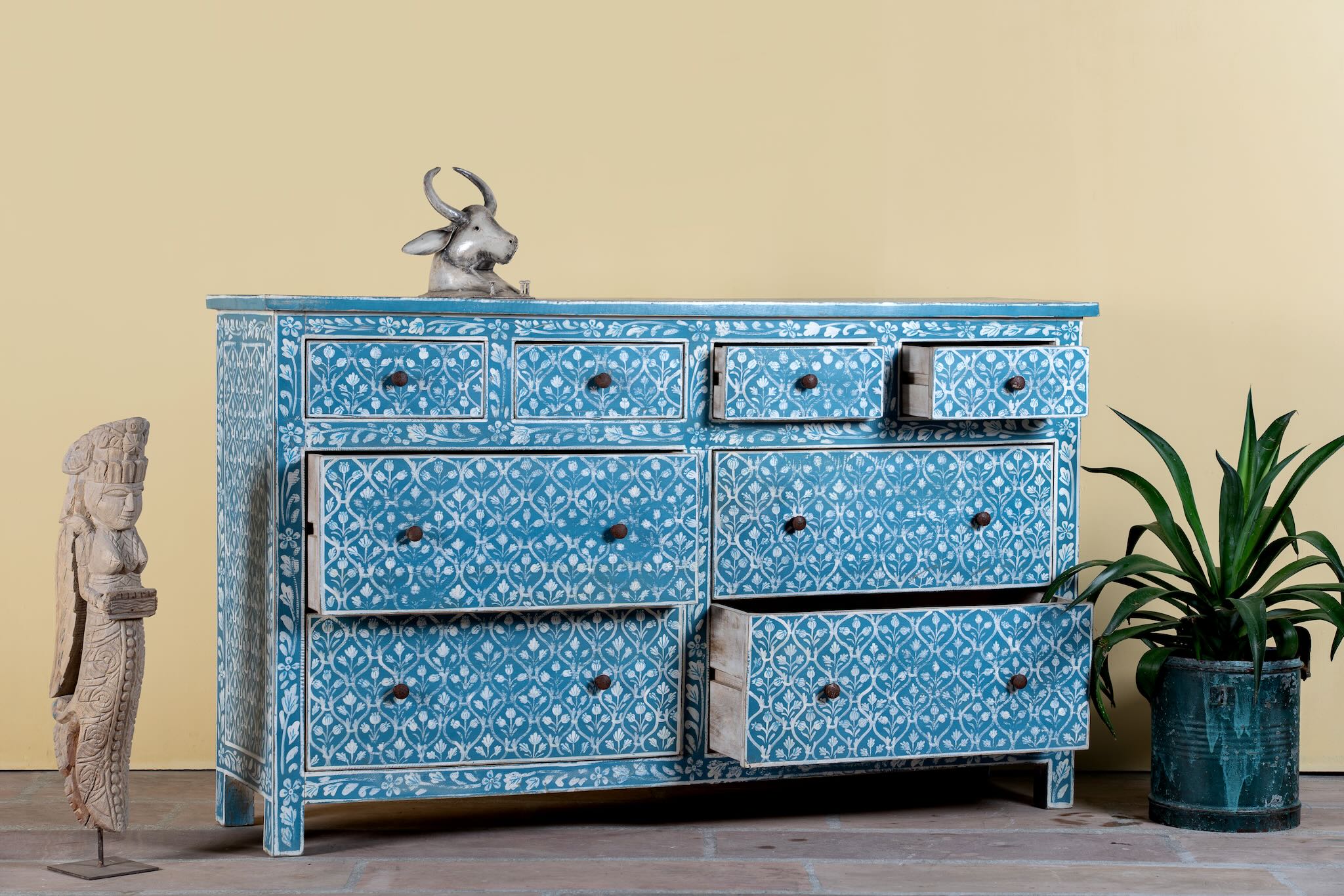 Side angle image with open drawers of a Hand-painted chest of drawers made of reclaimed wood in blue and white – Nitara model by Om Home & Garden