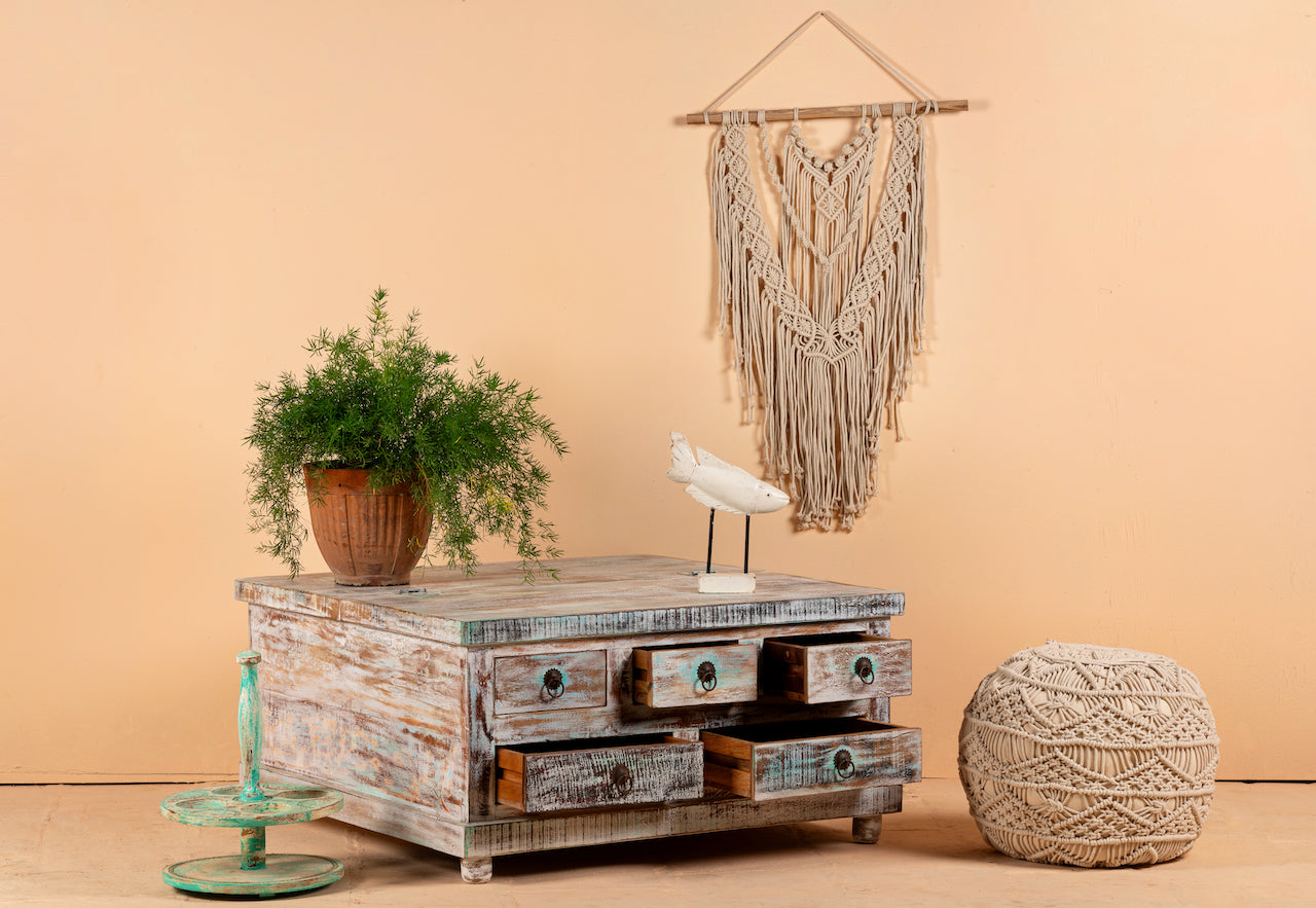 A rustic style Box Table Panipat made of mango wood, featuring a large box-like compartment and smaller drawers, displayed with a potted plant and decorative items.