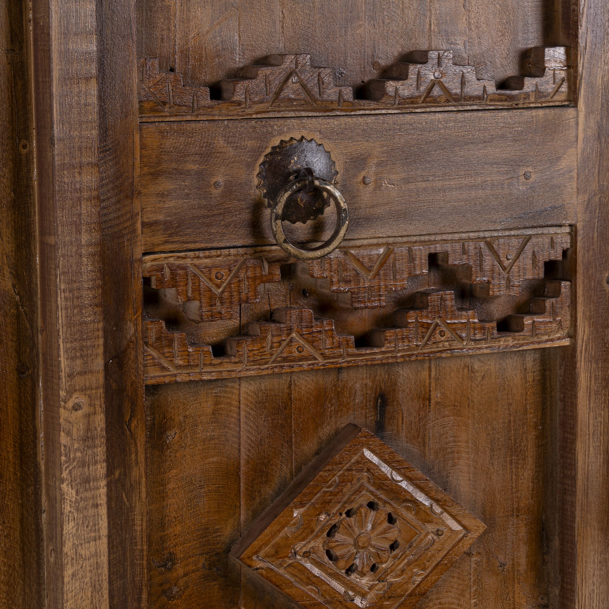 Close up image of an arched Moroccan-style door with frame made from reclaimed wood, featuring hand-carved details and a natural aged finish, suitable for wall décor or inbuilt installation.
