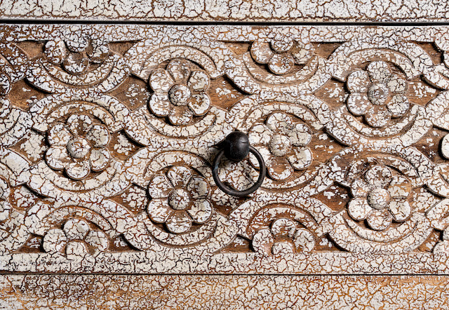 Close up image of a vintage mango wood furniture sideboard with hand-carved details and distressed style finish, 150 × 40 × 90 cm.