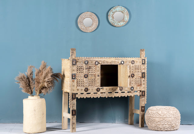 Side angle image with open door of a sandblasted antique Indian teak chest with hand-carved details, original iron fittings, and a naturally aged finish, ideal for bohemian or vintage-inspired interiors.