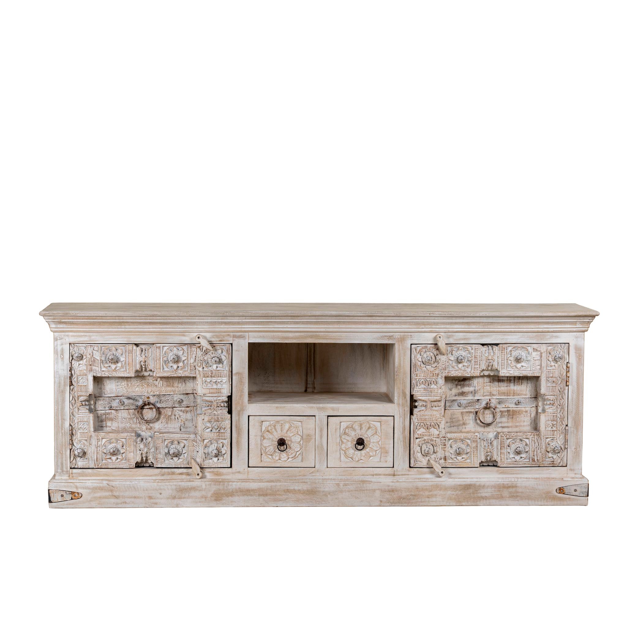 White background picture of a old door cabinet with hand-carved antique teak panels, whitewashed mango wood body, drawers and shelf, 180 × 40 × 70 cm.