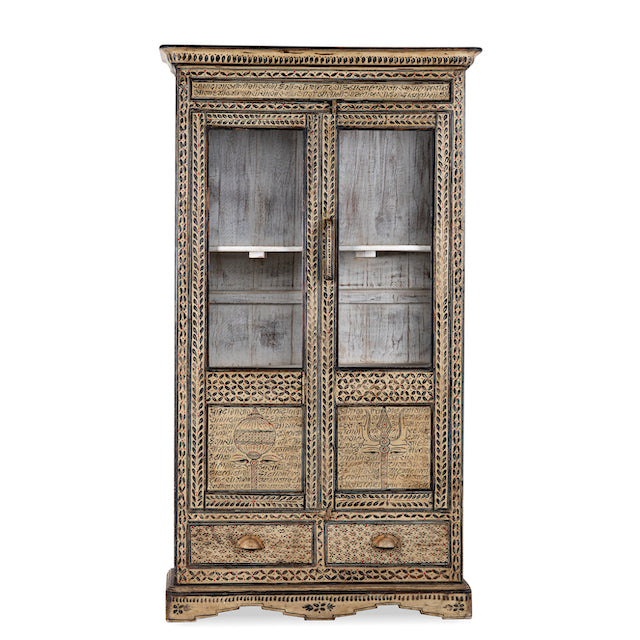 White background image of a hand-painted display cabinet made from recycled wood with glass doors – sustainable furniture featuring Sanskrit motifs and traditional Indian craftsmanship.