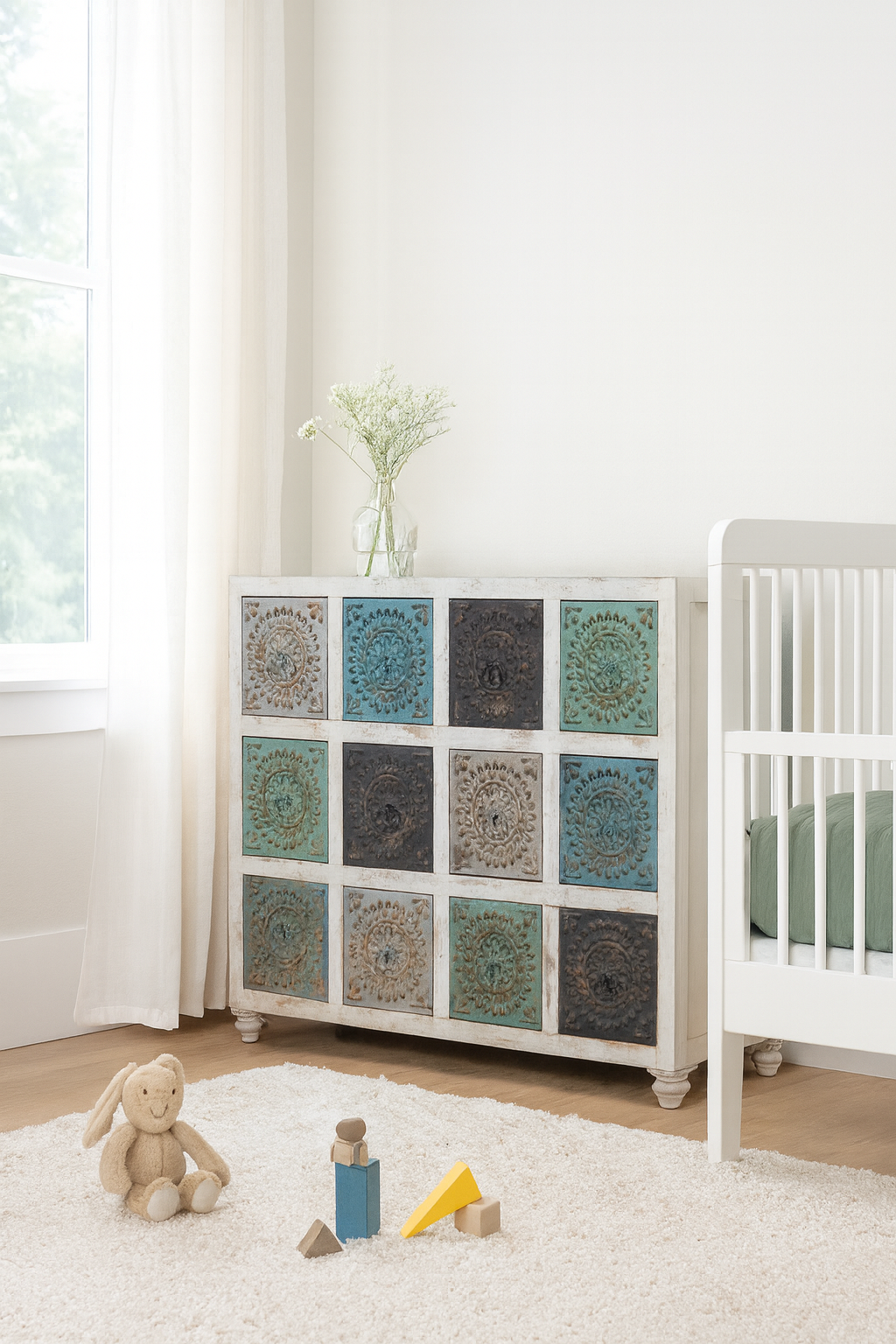 Lifestyle imagination of a carved mango wood chest of drawers with twelve multicolour floral drawer fronts, 124 × 40 × 102 cm.