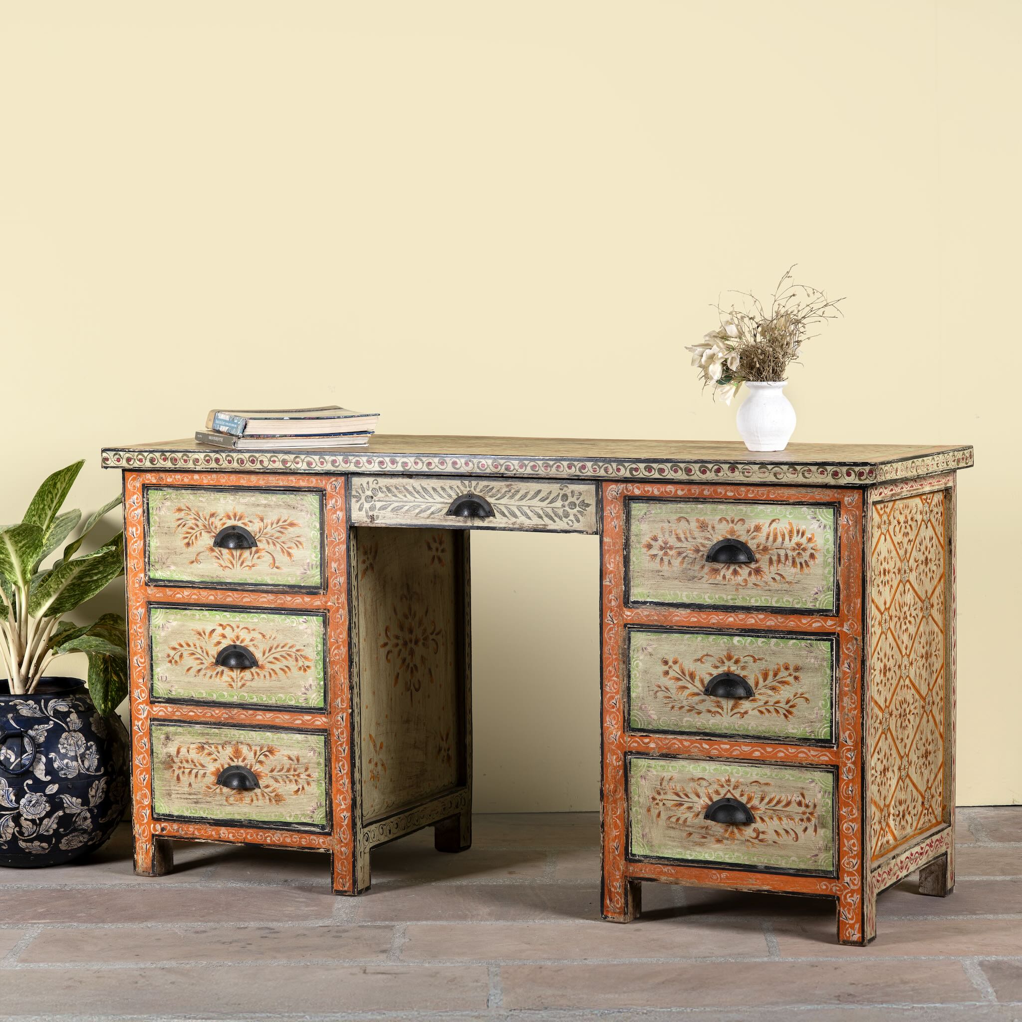 Side angle image of a hand-painted desk made of reclaimed wood with floral detailing – Tejasvini model by Om Home & Garden