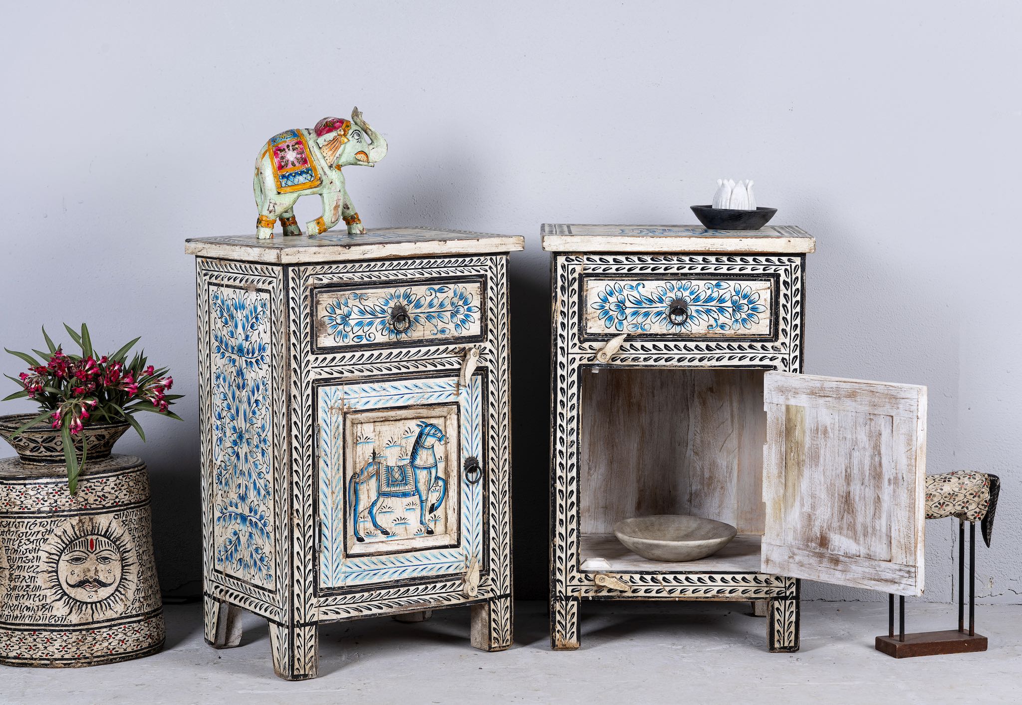 Side angle image with open door o a set of two hand painted night stands with floral and horse motifs; sustainable furniture made of reclaimed wood, 45 × 35 × 70 cm.