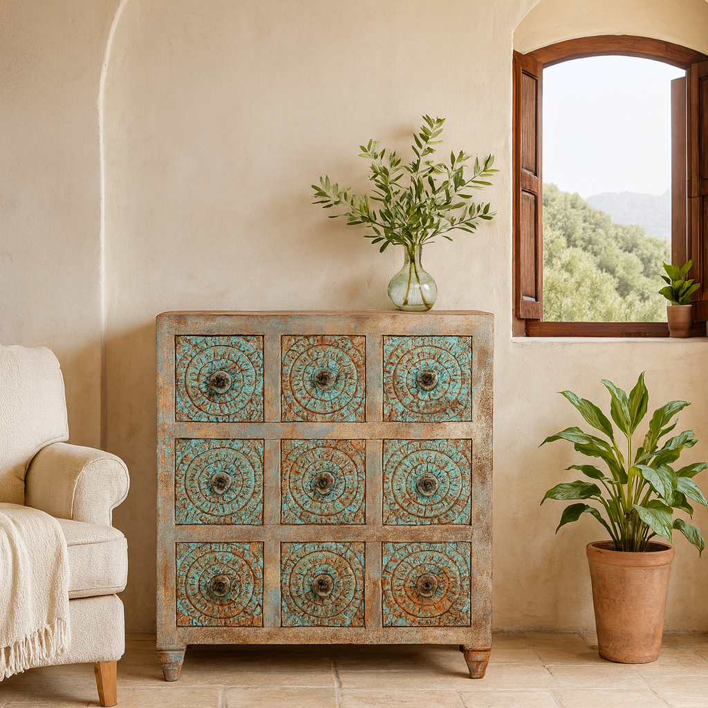 Decorative chest of drawers with turquoise patterns in a room with a window and plant.