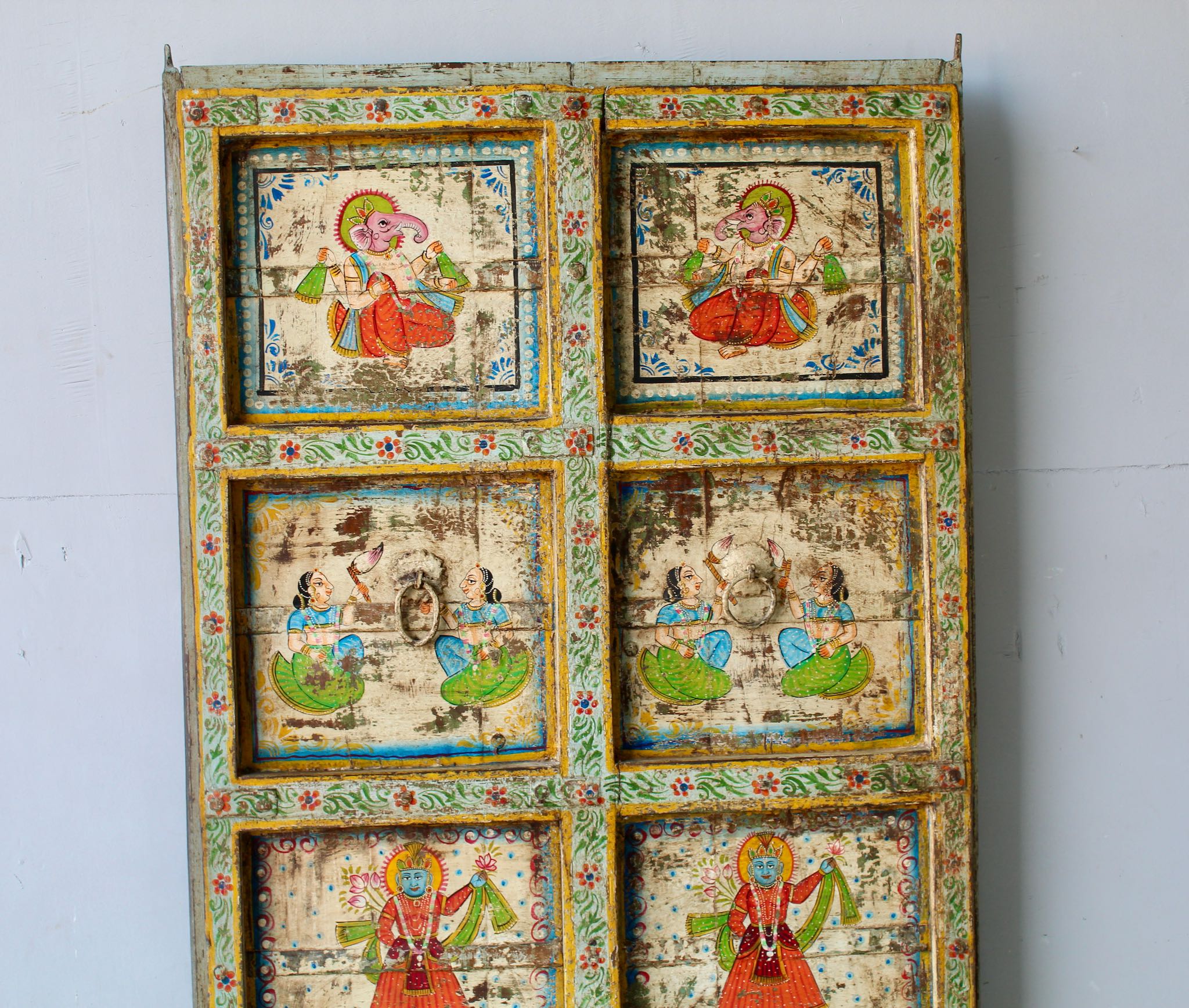 Hand-painted old Indian teak door panel with gods motifs in vintage style.