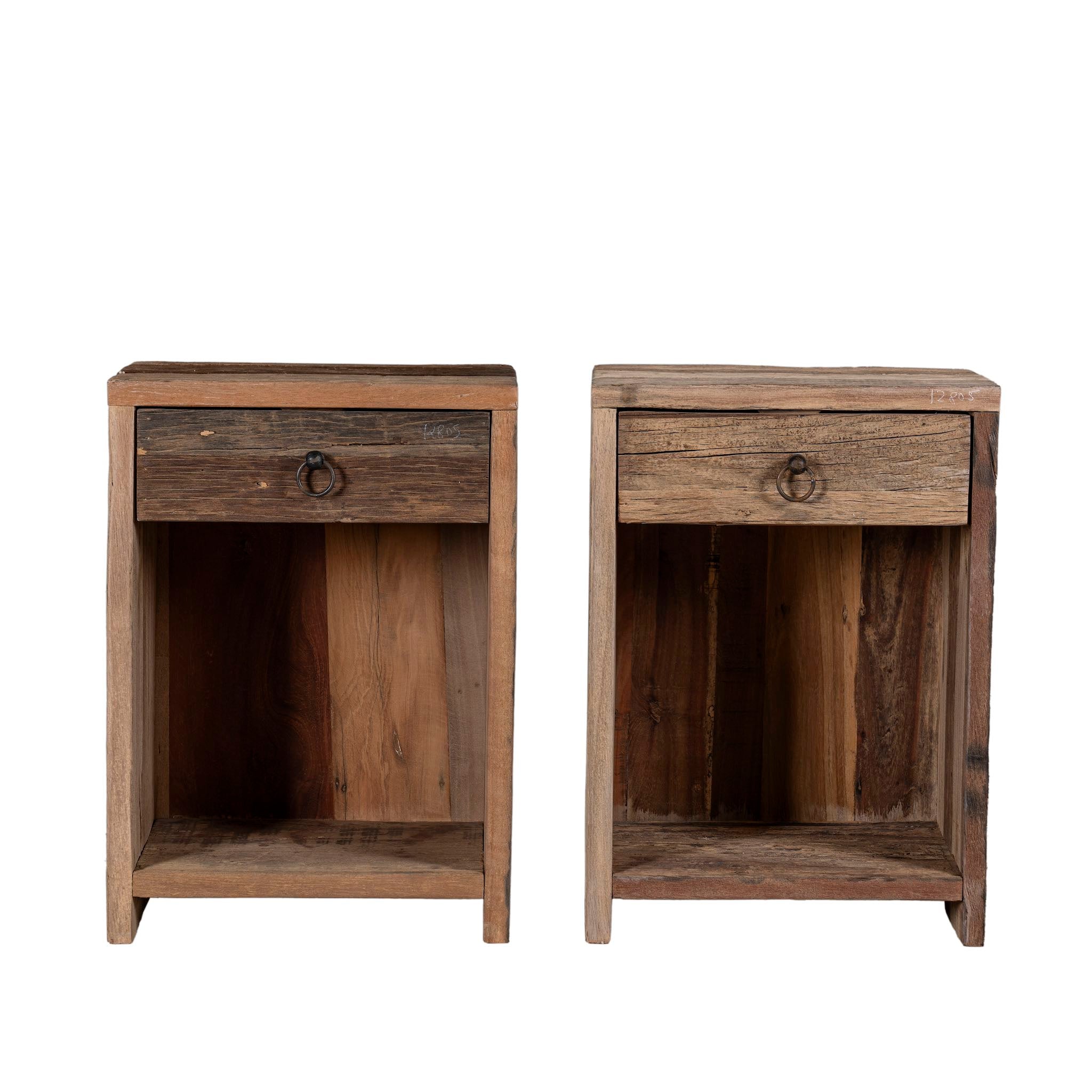 White background image of a pair of bedside tables in Driftwood/ Wabi Sabi style crafted from recycled old wood, each featuring a single drawer with a metal ring pull and an open shelf below, showcasing natural wood grain and rustic textures.