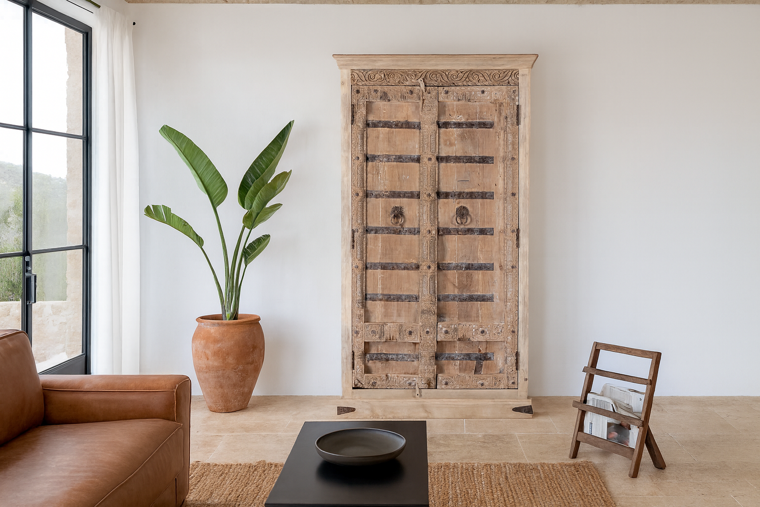 Lifestyle image with a Hand-carved teak wood wardrobe with original iron fittings – Veena model by Om Home & Garden