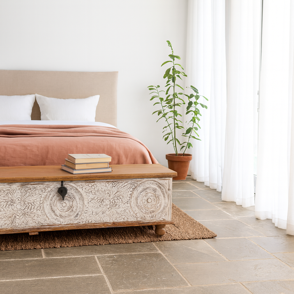 Lifestyle imagination of a long mango wood vintage display box and wood chest box with hand‑carved circular motifs, iron fittings and whitewashed finish; 180 × 55 × 46 cm.