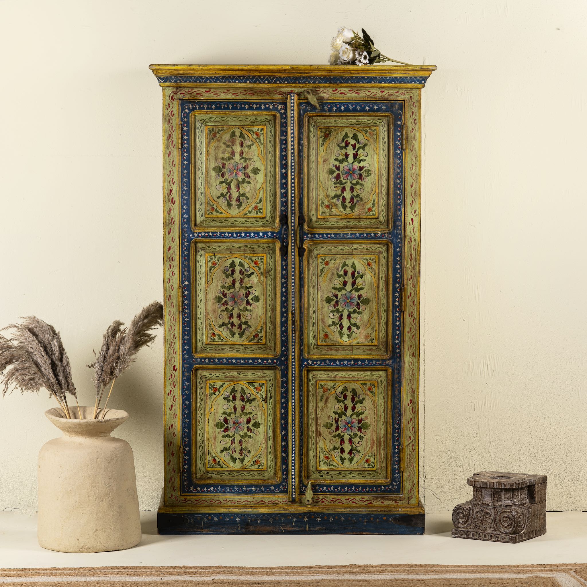 Hand painted wardrobe made from reclaimed wood with floral motifs and distressed finish; ideal for a boho chic living room or eclectic bedroom, 90 × 40 × 150 cm.