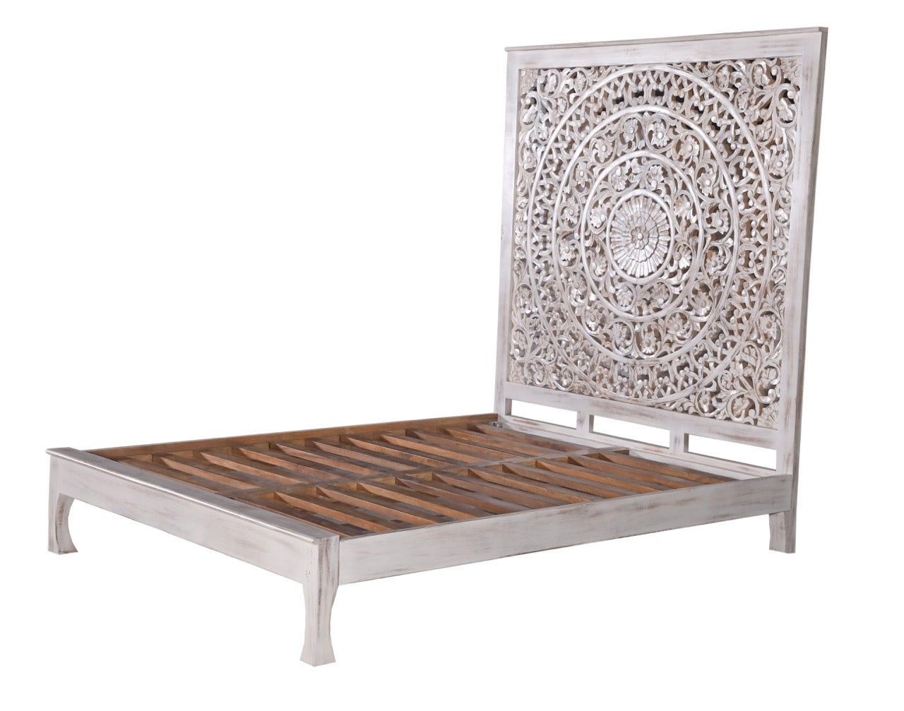 White background image of a white panel boho bed Flair in solid mango wood with carved floral headboard, Mediterranean-inspired bedroom furniture, 180 × 200 cm.