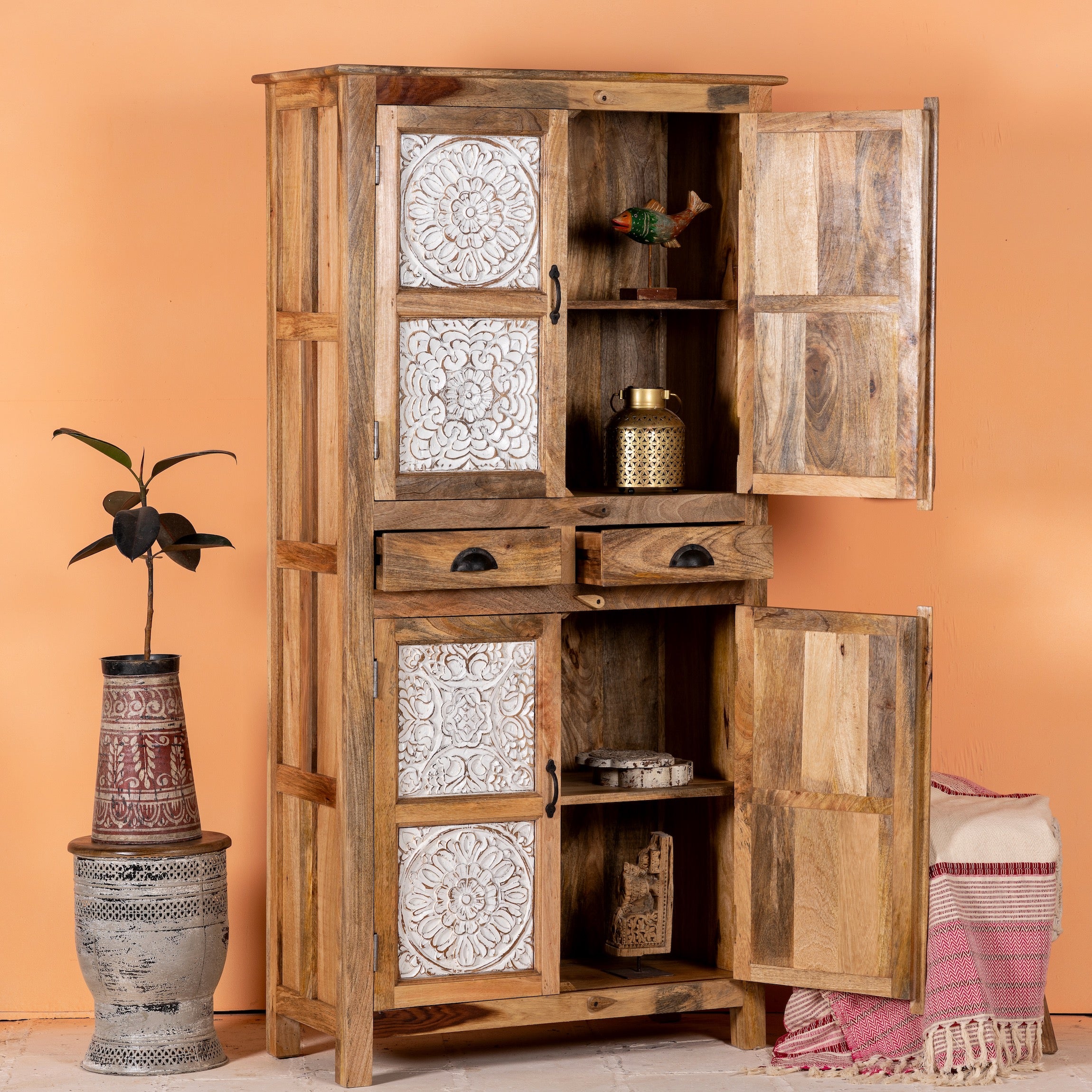 Open door image of a hand-carved wooden wardrobe made from mango wood with whitewashed floral carvings; perfect as bedroom furniture, 90 × 180 × 40 cm.