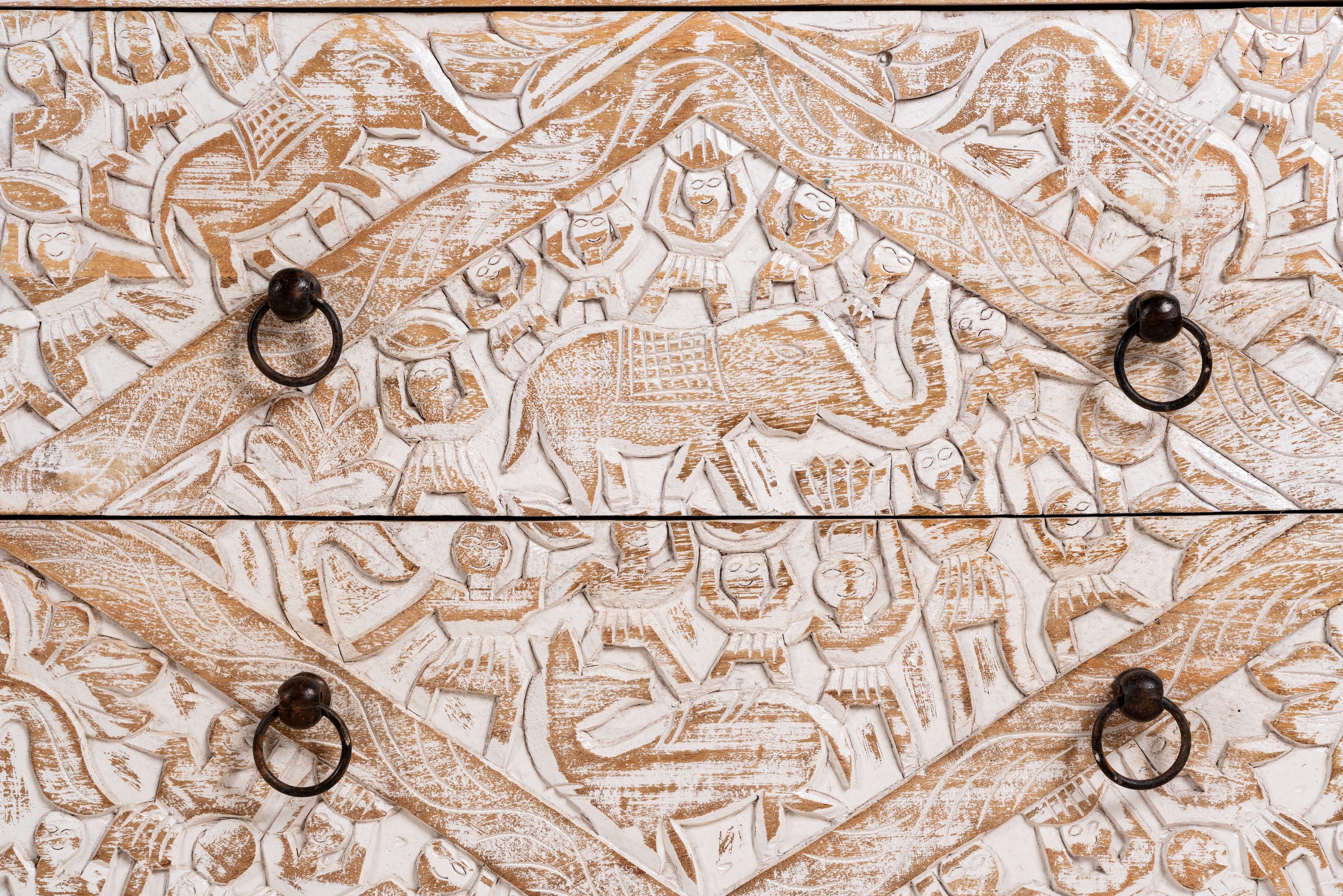 Close up image of a hand-carved mango wood sideboard with elephant motifs and whitewashed finish; ideal for vintage home decor, 153 × 80 × 40 cm.
