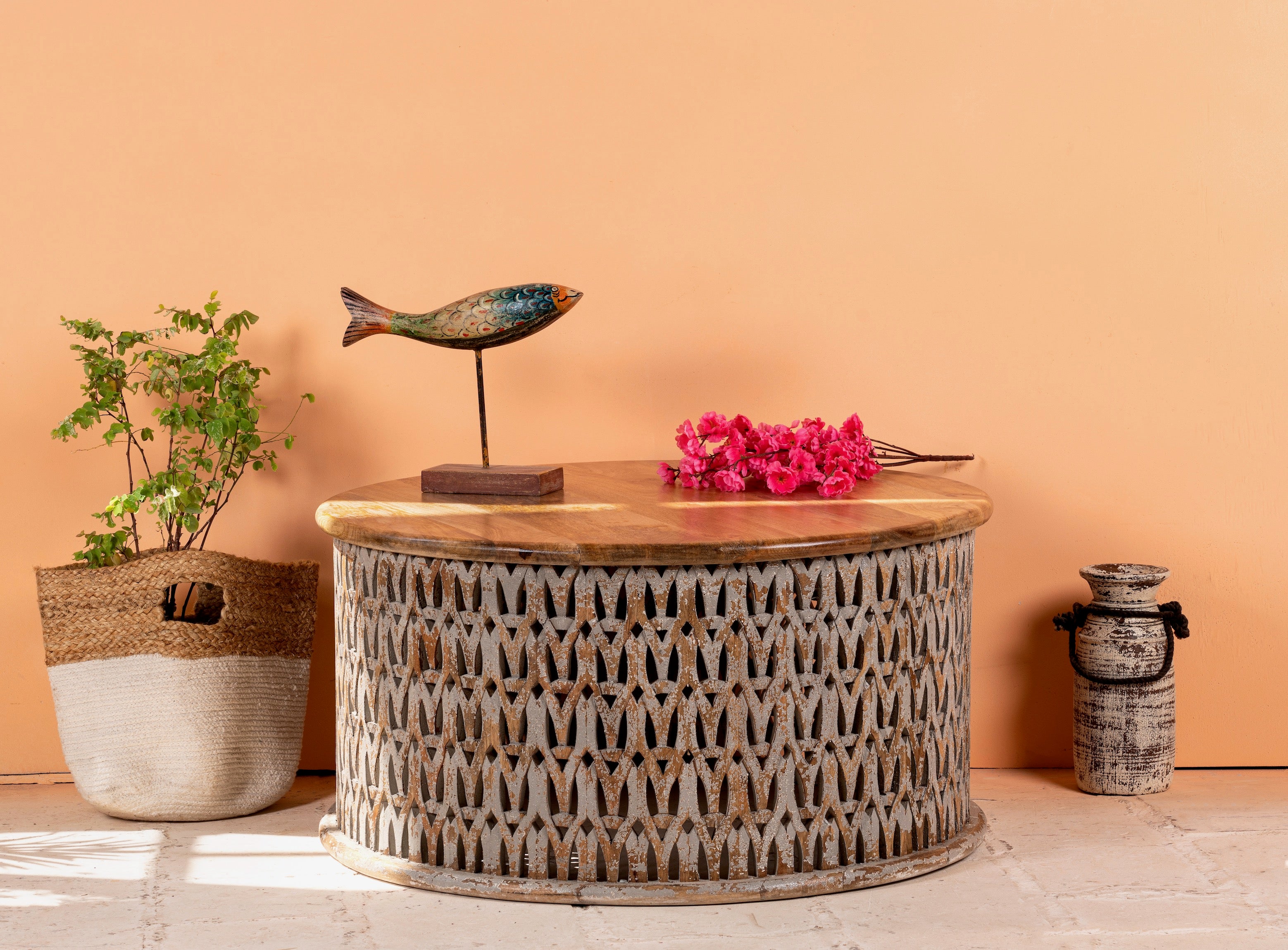 Round hand carved mango wood coffee table with white-washed base and natural wood top; 90 cm diameter, 45 cm height.