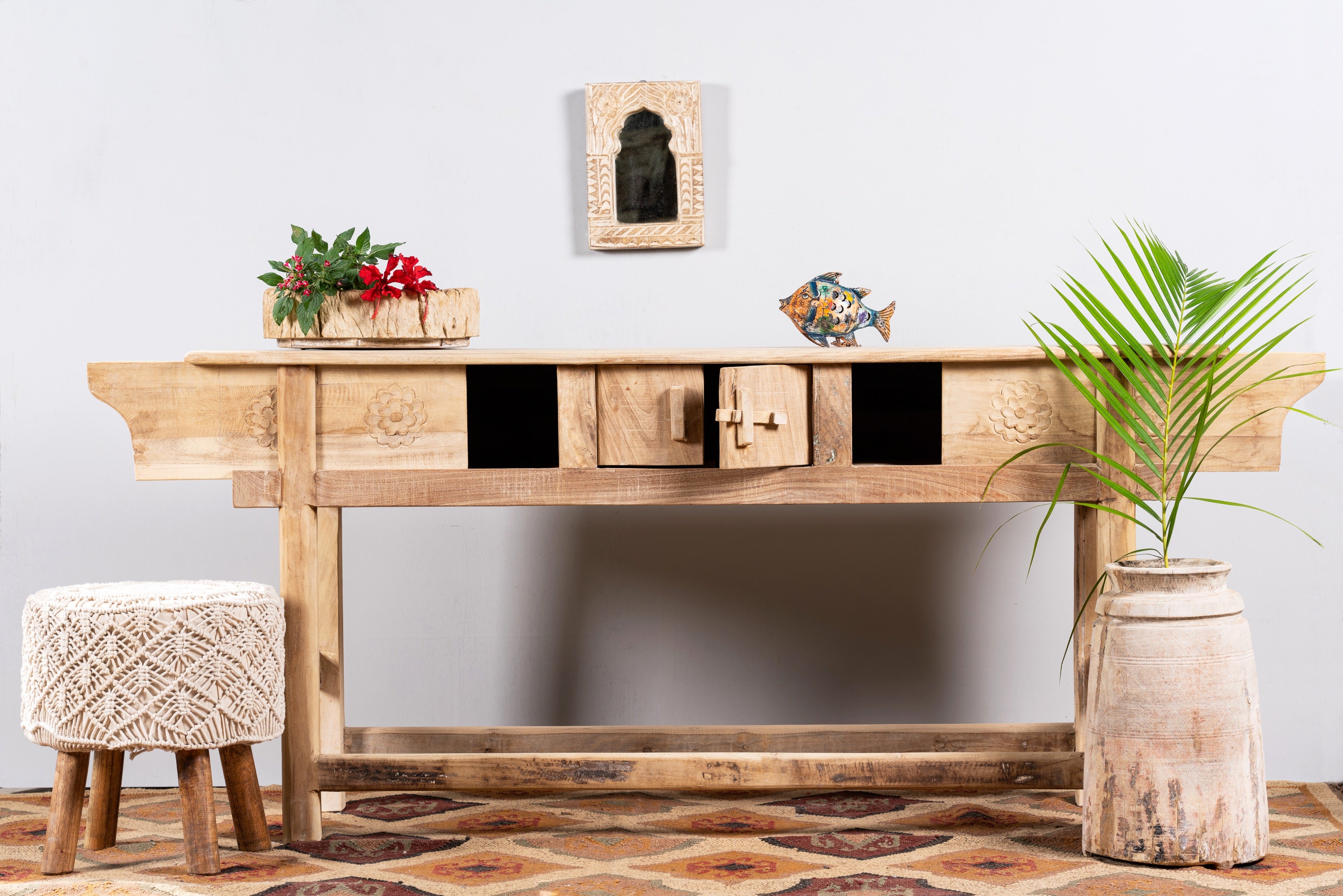 Image with pen drawer of a rustic reclaimed teak console table with hand-carved detailing and hidden side compartments; sustainable furniture, 170 × 82 × 48 cm.