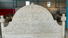 Image of a hand carved and white washed head board f a handcrafted Indian bed frame in solid mango wood with carved headboard and footboard, rustic bedroom furniture, 180 × 200 cm King size.