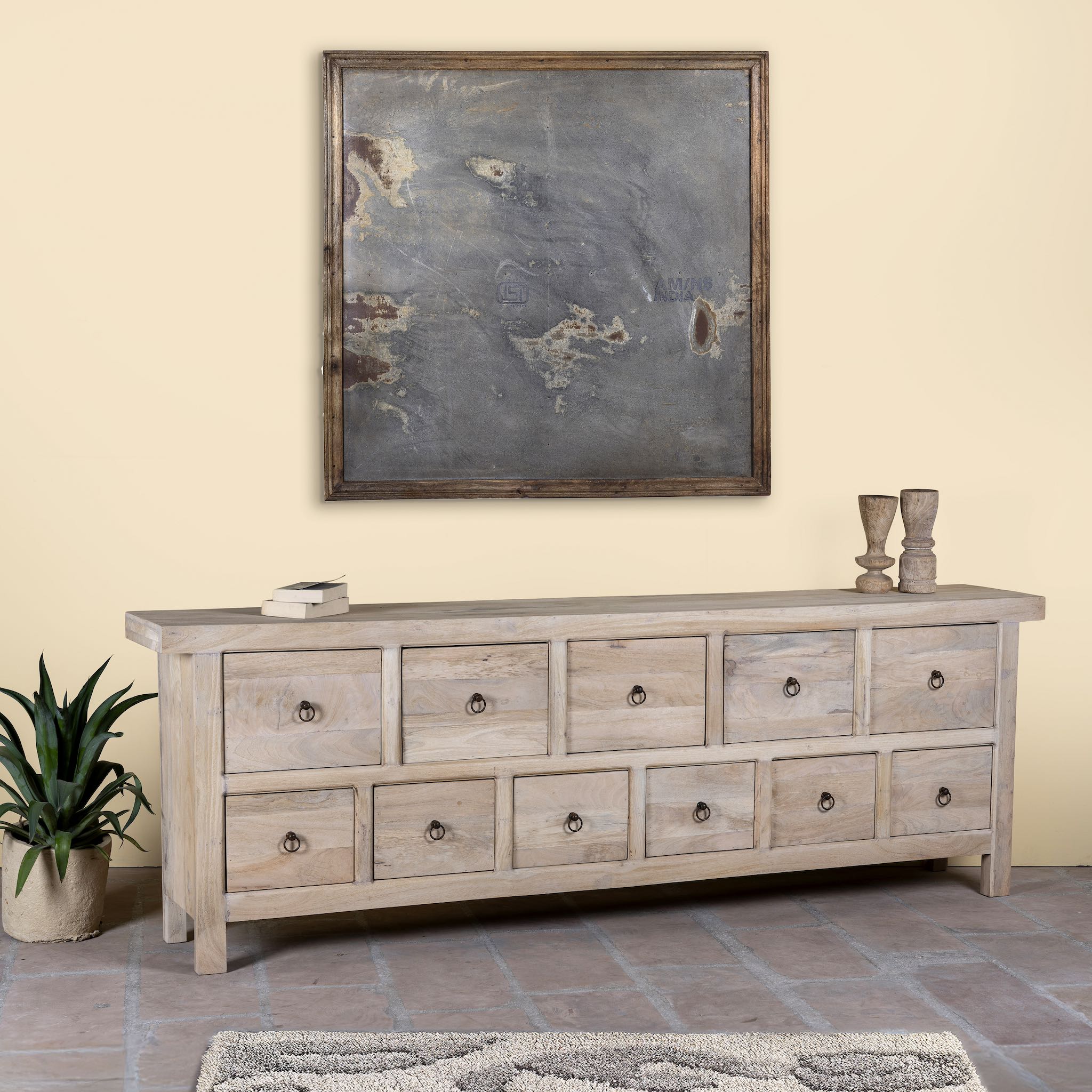Side angle image of a reclaimed sandblasted wooden chest of drawers with 11 drawers, part of our Ibiza style furniture collection.